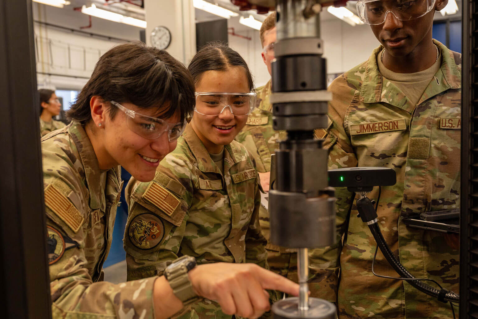 Cadets in the Mechanical Engineering Lab examine a piece of alloy during a tensile test at the U.S. Air Force Academy, Colo., March 18, 2026. As part of the test, cadets analyze the material's properties to determine its suitability for a project's design. (U.S. Air Force photo by Tech. Sgt. Zach Vaughn)