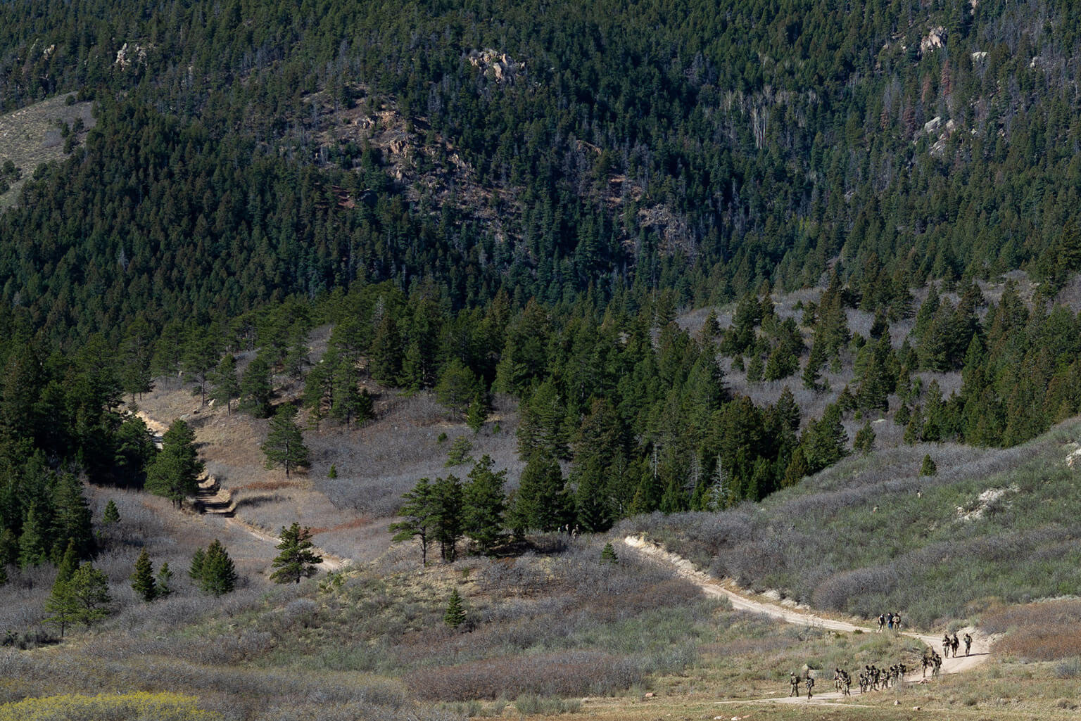 Cadets travel to their defensive positions within their Joint Operations Area during the Spring Culminating Exercise (CULEX) at the U.S. Air Force Academy, Colo., April 16, 2026. The CULEX applied classroom learning and small-group military training in a notional field training environment, where cadets practiced command and control, cyber operations, and integrating space effects into their mission planning and other joint force capabilities. (U.S. Air Force photo by Ray Bahner)