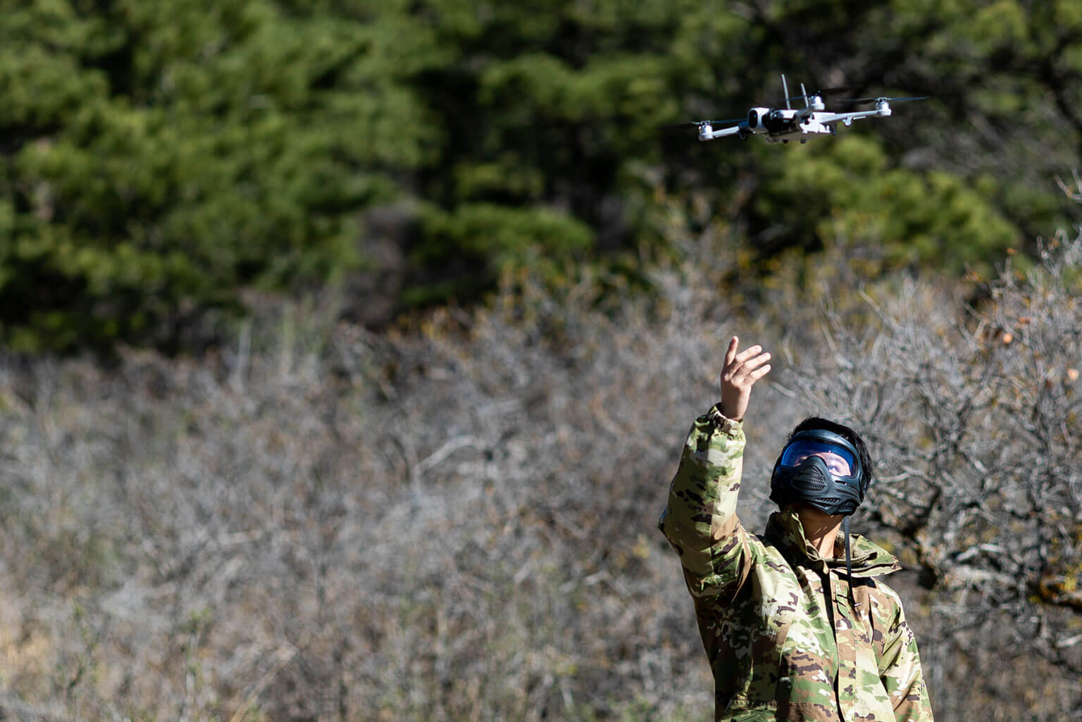 A cadet launches a drone to support base defense within the Joint Operations Area during the Spring Culminating Exercise (CULEX) at the U.S. Air Force Academy, Colo., April 16, 2026. Academy officials directed the CULEX as a cumulative test for cadets to incorporate lessons learned during their Basic Cadet Training, Silver Training weekends, and individual leadership training. (U.S. Air Force photo by Ray Bahner)