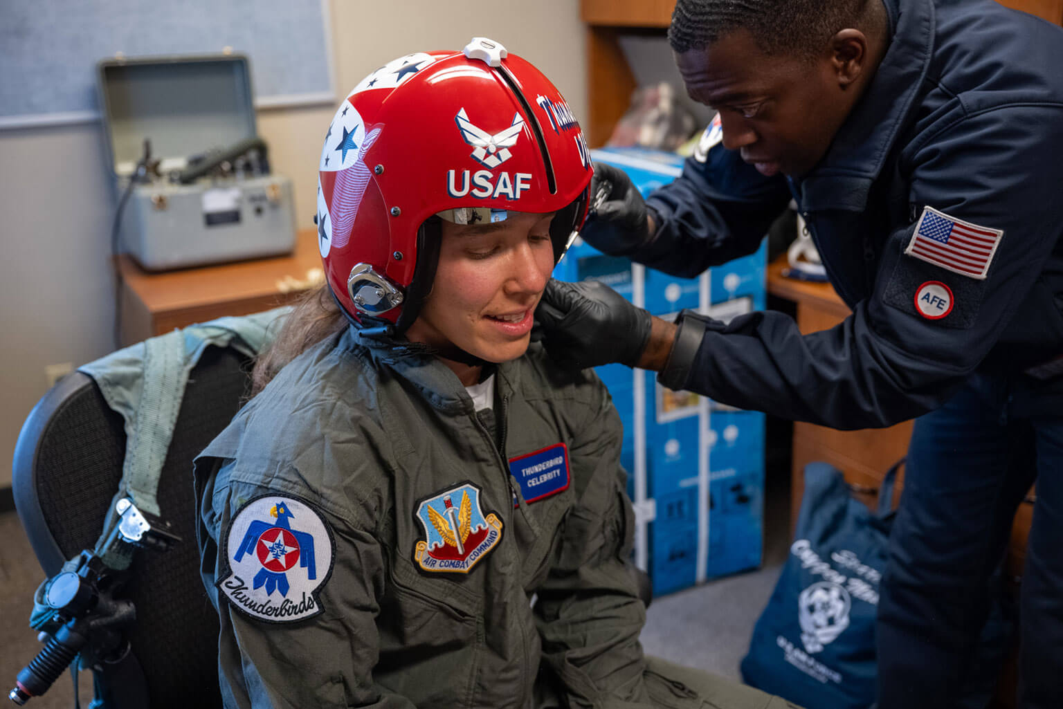 Taylor Lorbiecki, a U.S. Air Force Academy assistant strength and conditioning coach, is fitted for flight gear prior to her orientation flight with the U.S. Air Force Thunderbirds at Peterson Space Force Base, Colorado, May 27, 2026. The flight honored Lorbiecki, the Academy’s Academic Year 2025-2026 Civilian Instructor of the Year, whose work supports cadets across the Academy. She led the development of the Academy's Rated Physical Readiness capstone course to build the mental, physical, nutritional, and recovery capabilities required for rated assignments. (U.S. Air Force photo by Tiana Williams)