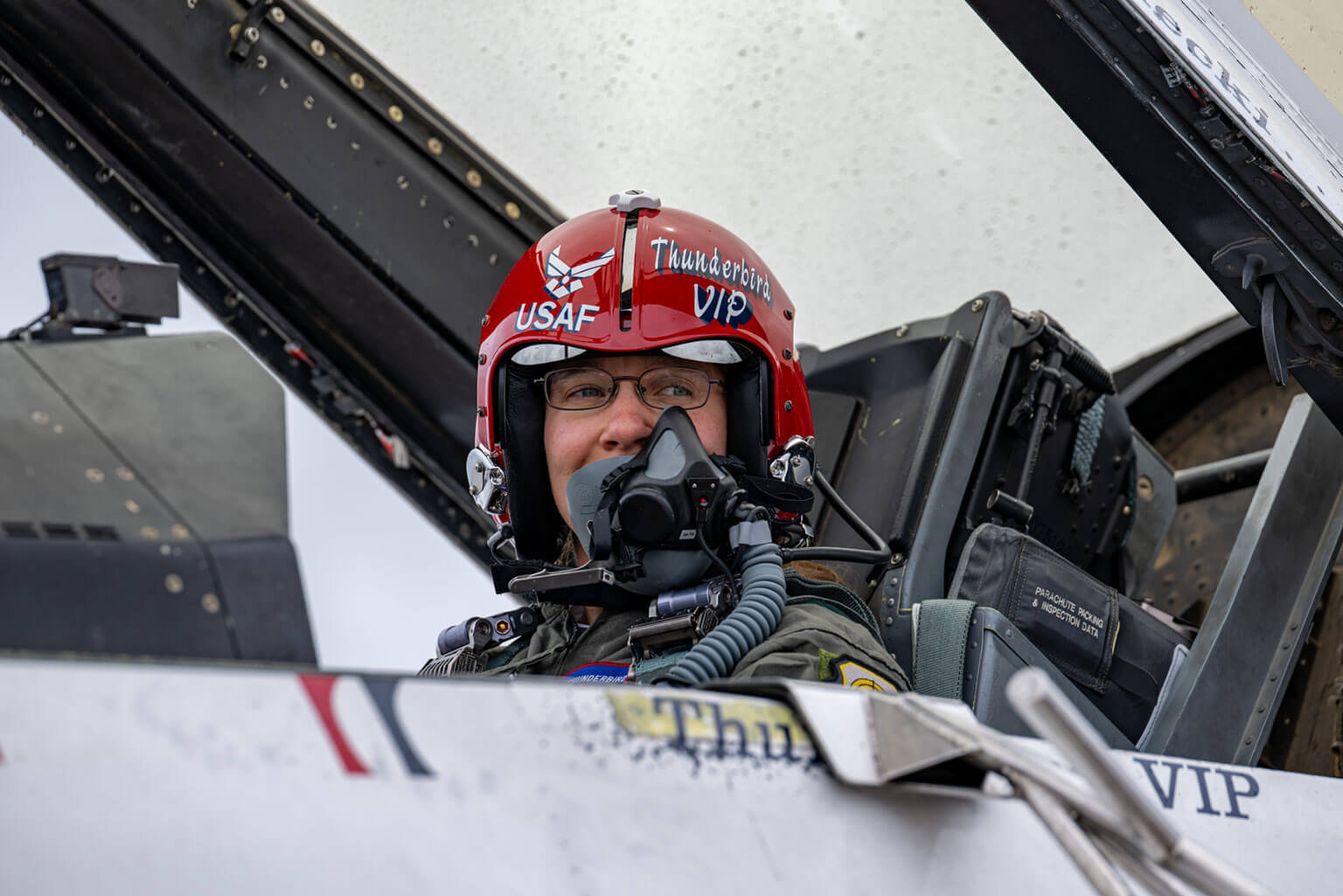 Taylor Lorbiecki sits in the cockpit of a U.S. Air Force Thunderbird F-16 Fighting Falcon before taking off for an orientation flight over Colorado Springs, Colorado, May 27, 2026. The flight honored Lorbiecki, the Academy’s Academic Year 2025-2026 Civilian Instructor of the Year, whose work supports cadets across the Academy. Lorbiecki led the development of the Academy's Rated Physical Readiness capstone course to build the mental, physical, nutritional, and recovery capabilities required for rated assignments. (U.S. Air Force photo by Tiana Williams)