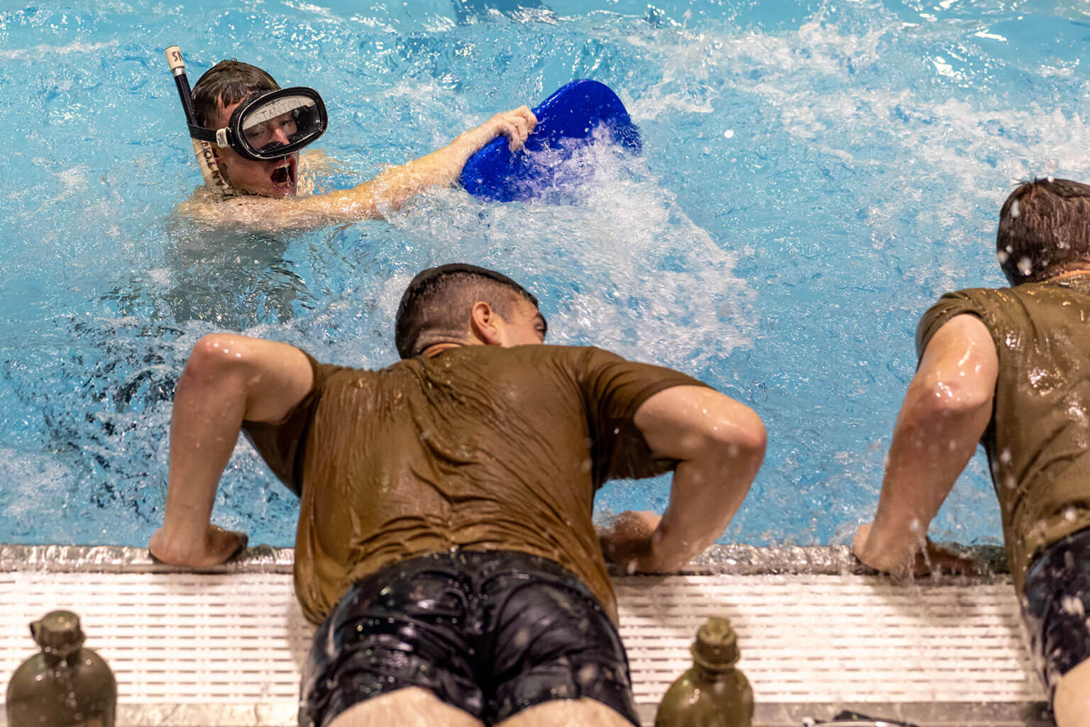 A cadet douses a fellow cadet with water during a Special Warfare Orientation Course (SWOC) physical training session at the U.S. Air Force Academy, Colo., June 13, 2026. SWOC provides Academy and ROTC cadets with first-hand insight on the demands of Air Force Special Warfare while enabling them to develop leadership, teamwork and communication skills under pressure. (U.S. Air Force photo by Jonathan Suni)