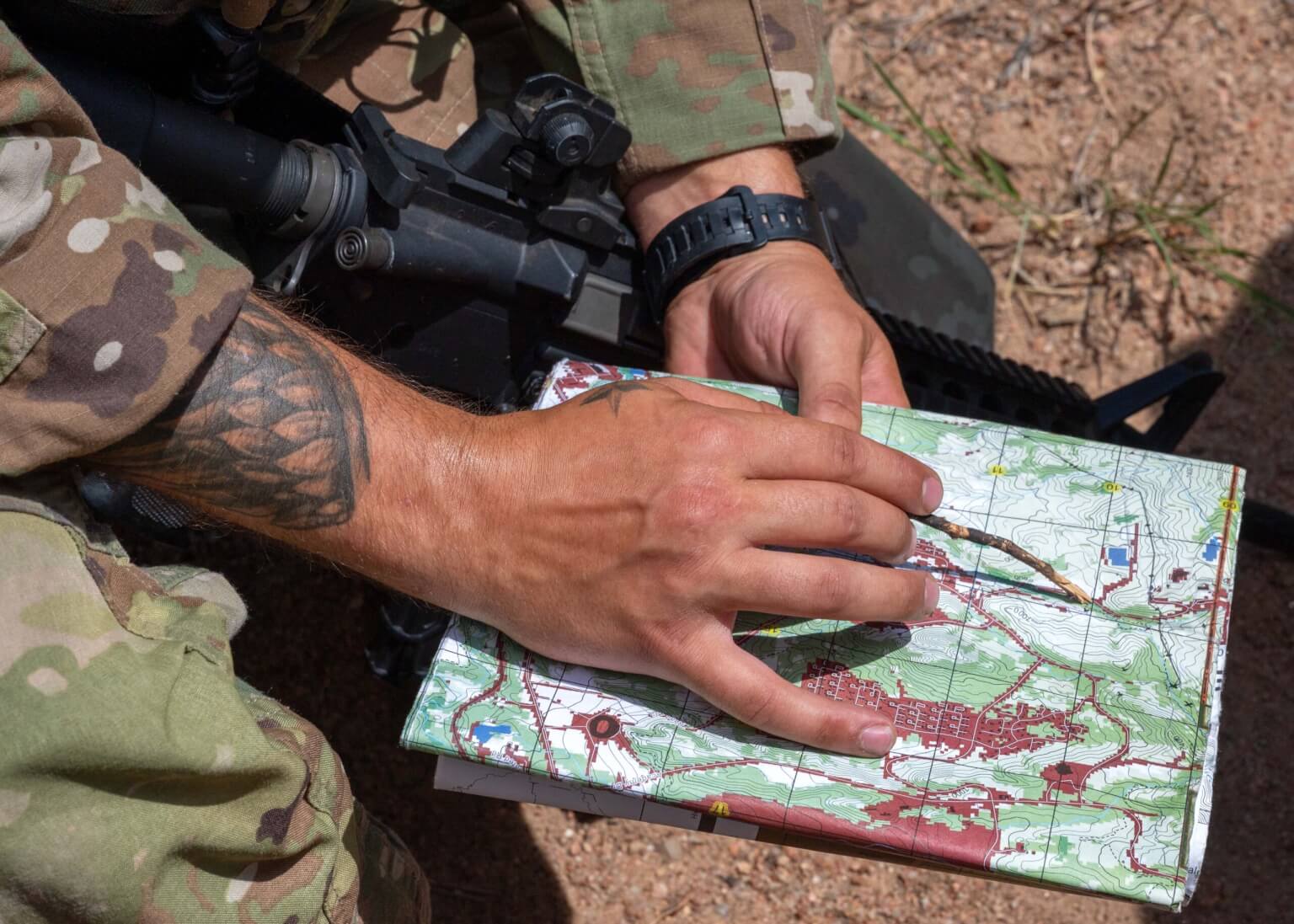 A Cadet Warfighter Instructor’s Course (CWIC) participant orients his squad to an observation post using a topographical map during a Field Training Exercise at the U.S. Air Force Academy, Colo., July 28, 2026. CWIC prepares cadets to lead, teach expeditionary skills to fellow cadets and build warfighter readiness for the future fight. (U.S. Air Force photo by Tech. Sgt. Zach Vaughn)