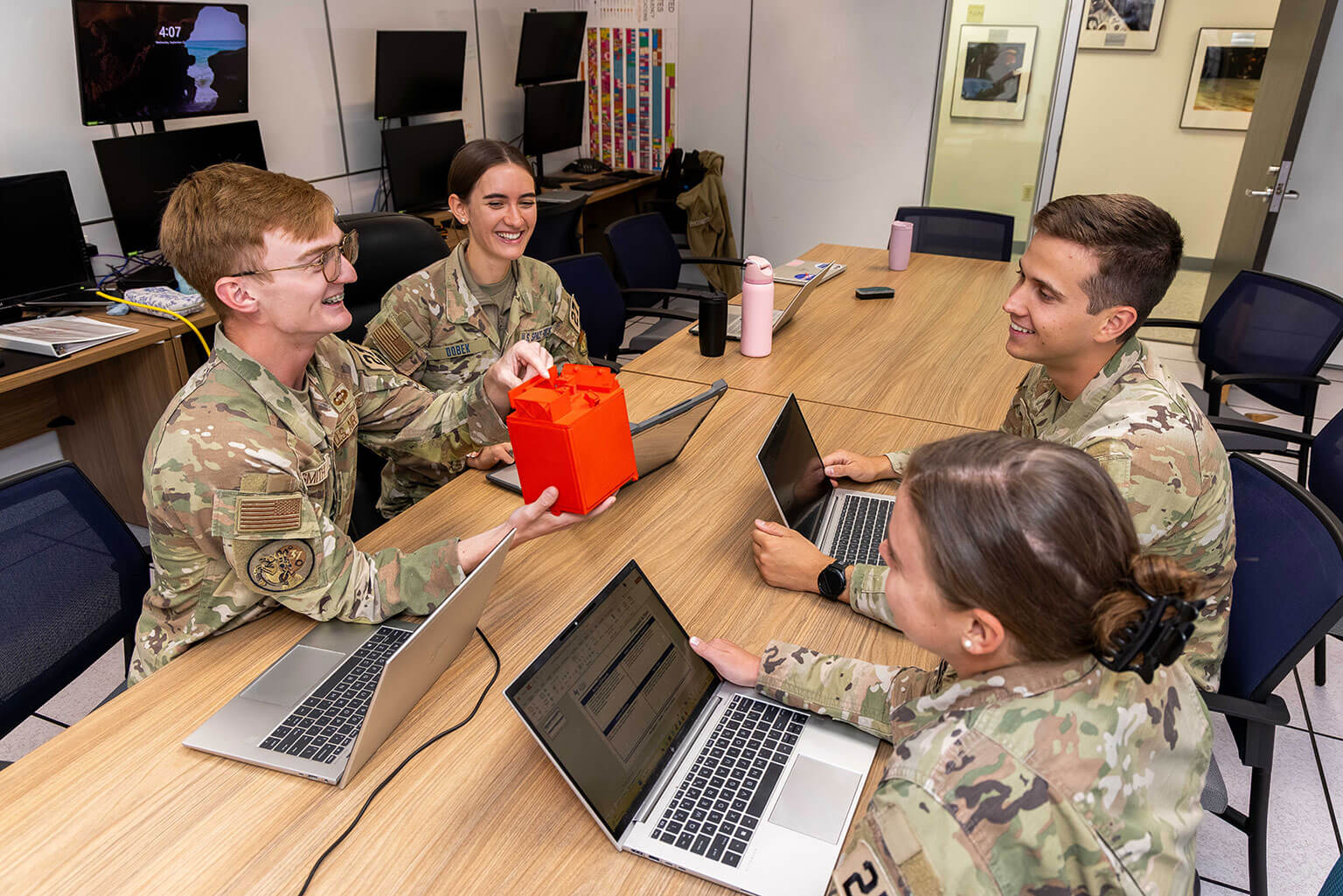 U.S. Air Force Academy cadets collaborate on FalconSAT 11 during a capstone class at the Academy in Colorado Springs, Colo., Sept. 23, 2026. The FalconSAT program gives cadets hands-on experience applying classroom knowledge to satellite design, testing, building and operations. (U.S. Air Force photo by Trevor Cokley)