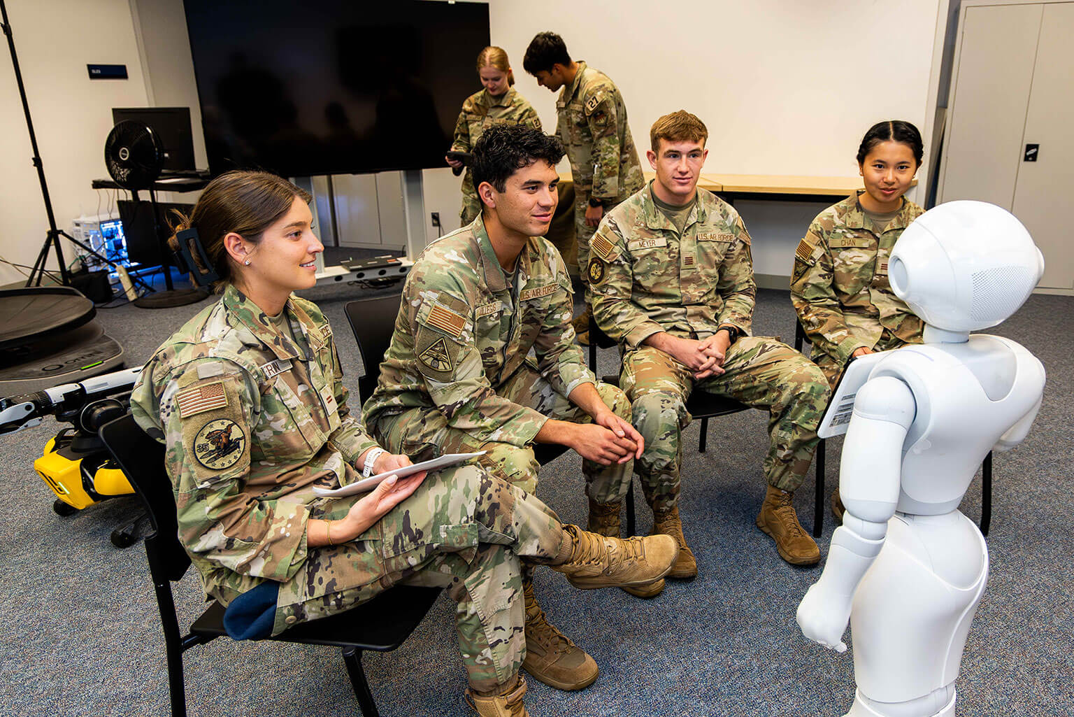 Cadets work with Pepper, a humanoid robot, at the Warfighter Effectiveness Research Center at the U.S. Air Force Academy, Colo., Oct. 14, 2026. The research gives cadets hands-on experience studying human-machine teaming and how emerging technologies may influence future military operations. (U.S. Air Force photo by Trevor Cokley)