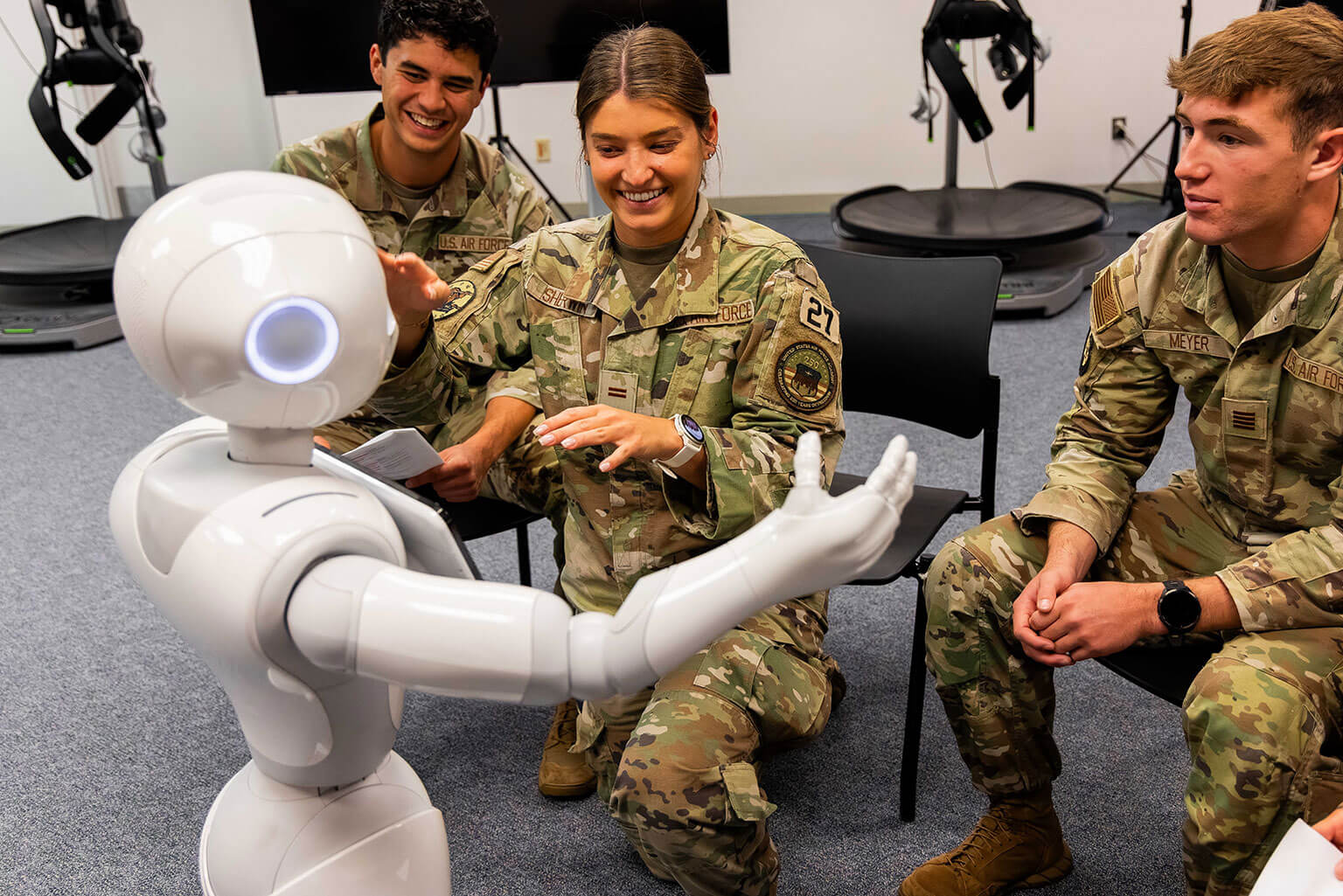Cadets interact with Pepper, a humanoid robot, at the Warfighter Effectiveness Research Center at the U.S. Air Force Academy, Colo., Oct. 14, 2026. Researchers use Pepper to study human-machine teaming and how people interact with autonomous and artificial intelligence-enabled systems. (U.S. Air Force photo by Trevor Cokley)