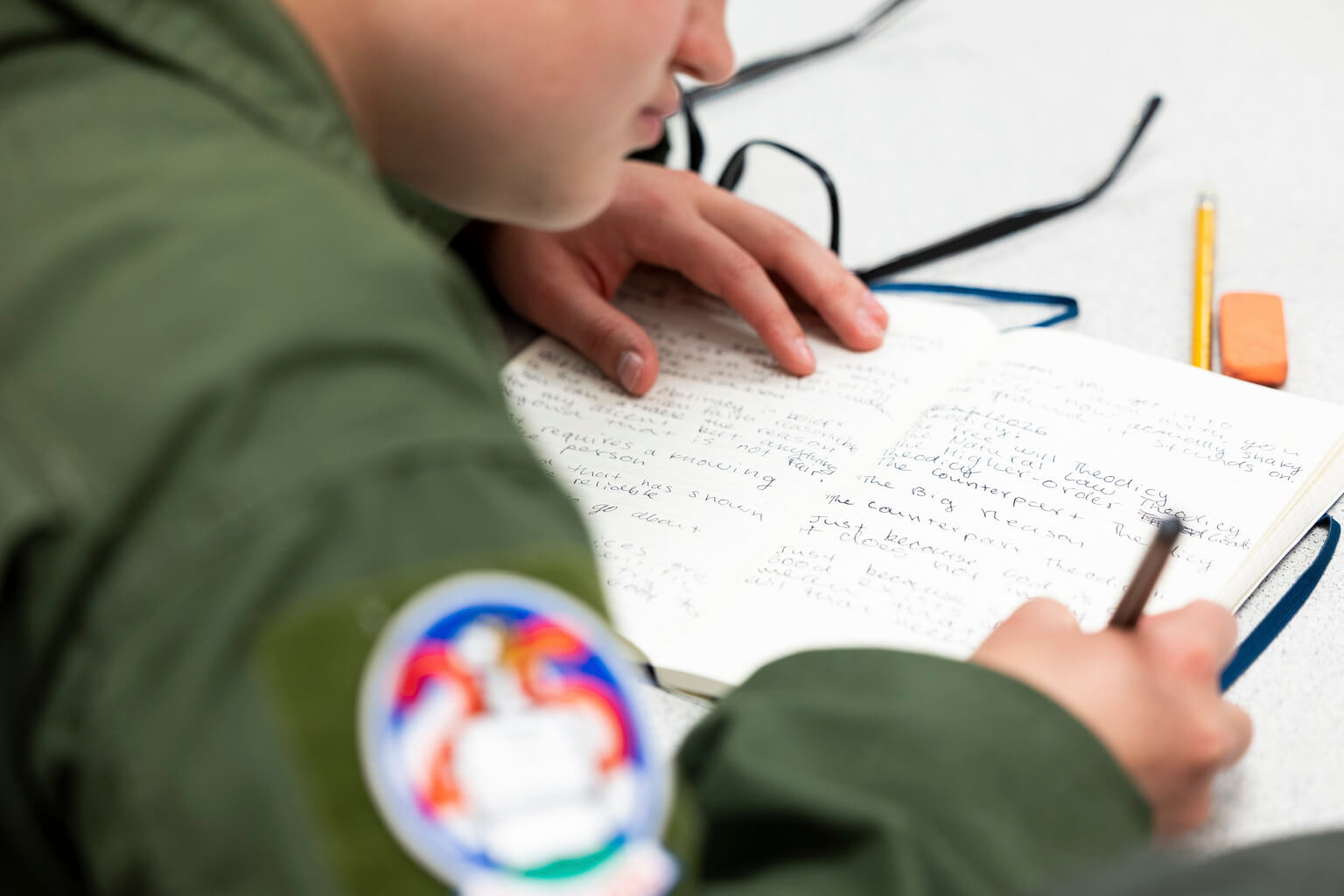 A U.S. Air Force Academy cadet takes notes during a C.S. Lewis and Philosophy class at the Academy in Colorado Springs, Colorado, Oct. 22, 2026. The course examines philosophical ideas through the writings of C.S. Lewis, giving cadets opportunities to engage with subjects beyond their primary fields of study. (U.S. Air Force photo by Ray Bahner)