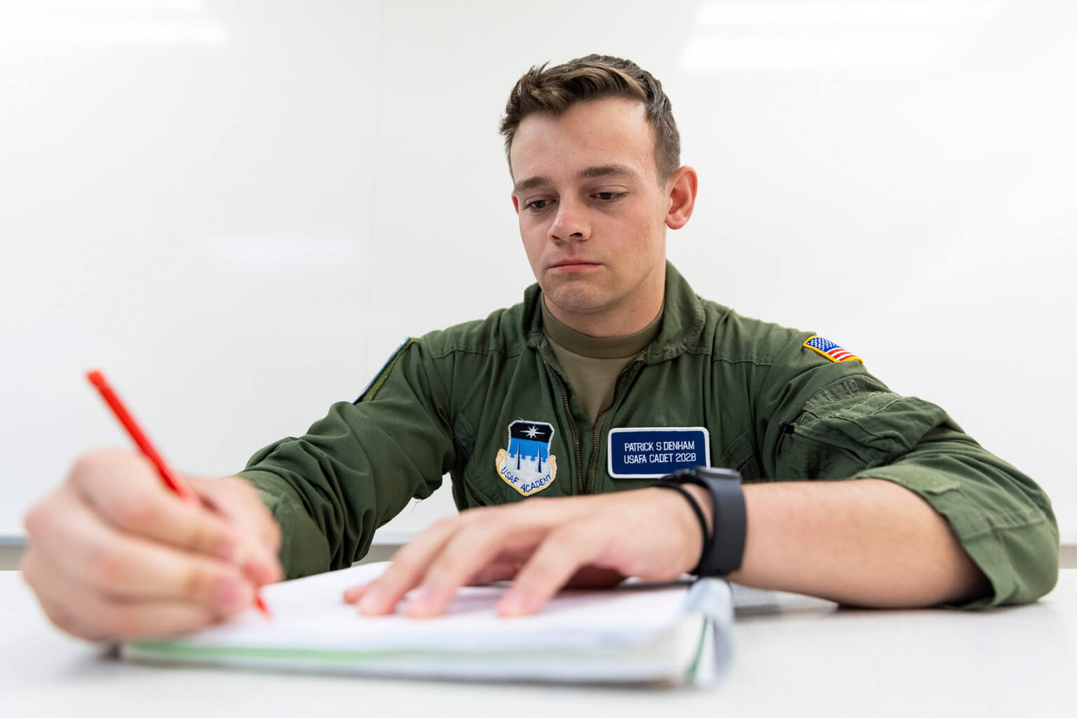 U.S. Air Force Academy Cadet 2nd Class Patrick Denham takes notes during a philosophy class at the Academy in Colorado Springs, Colorado, Oct. 22, 2026. Denham, a Systems Engineering major, is pursuing minors in French and Religion Studies to explore language, philosophy and religious traditions beyond his technical field. (U.S. Air Force photo by Ray Bahner)