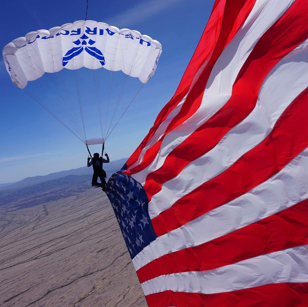 Wings of Blue member skydiving with US flag