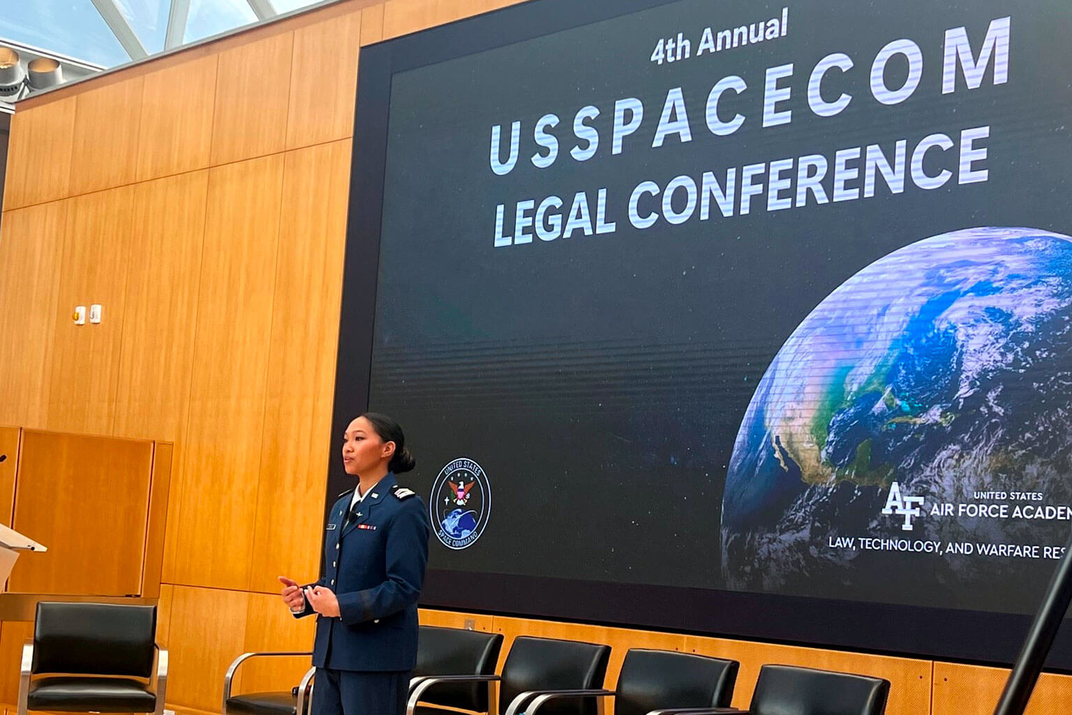 Cadet 2nd Class Genevieve Sabado gives a lightning talk to space law and government practitioners during the fourth annual USSPACECOM legal conference.