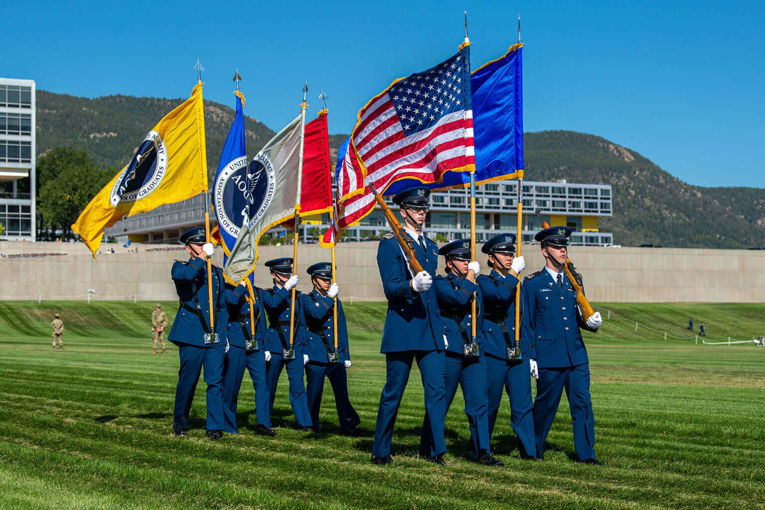 Uniformed Cadet Honor Guard members hold flags while presenting the colors at the Parents' Day Parade. Uniformed Cadet Honor Guard members hold flags while presenting the colors at the Parents' Day Parade.