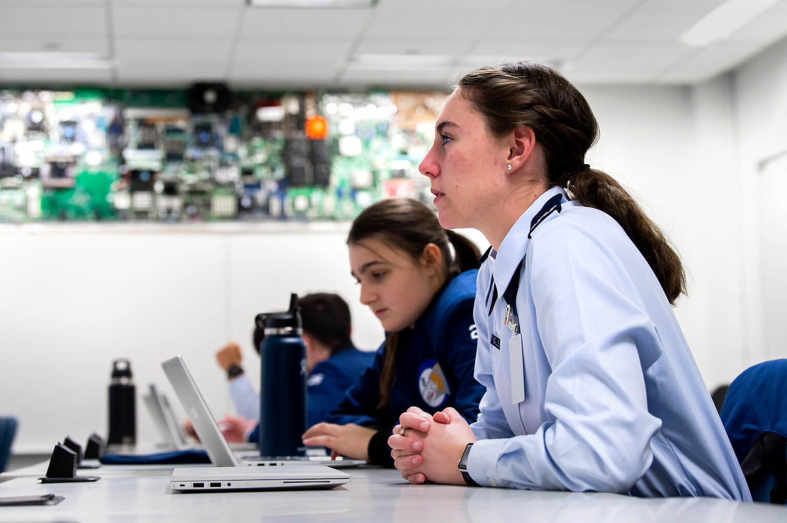 Female cadets at classroom table