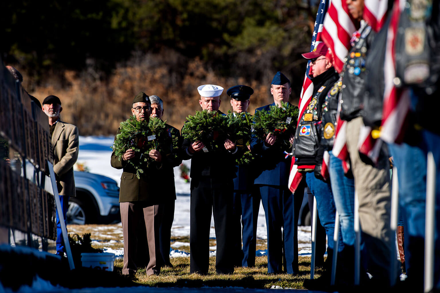 Members of the military laying wreaths.