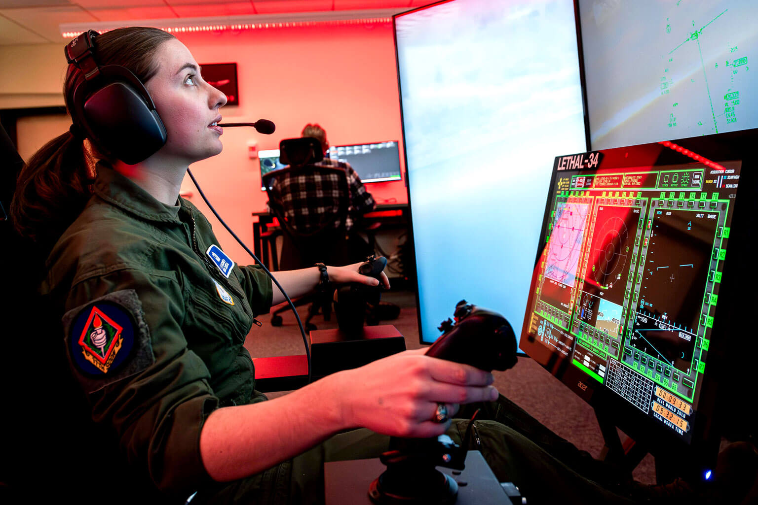 U.S. Air Force Academy Cadet 1st Class Lauren Blackwelder flies a simulator.