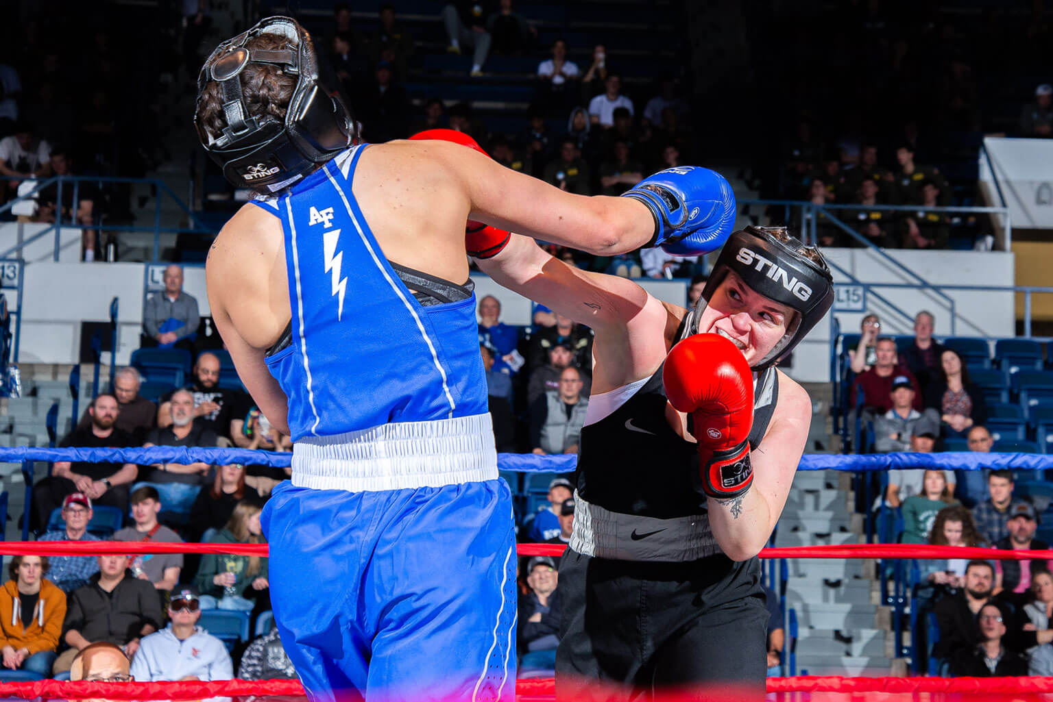 Cadet 2nd Class Billie Botes boxes her teammate, Cadet 2nd Class Peyton Glenn, both Class of 2025, during the Boxing Wing Open at the U.S. Air Force Academy.