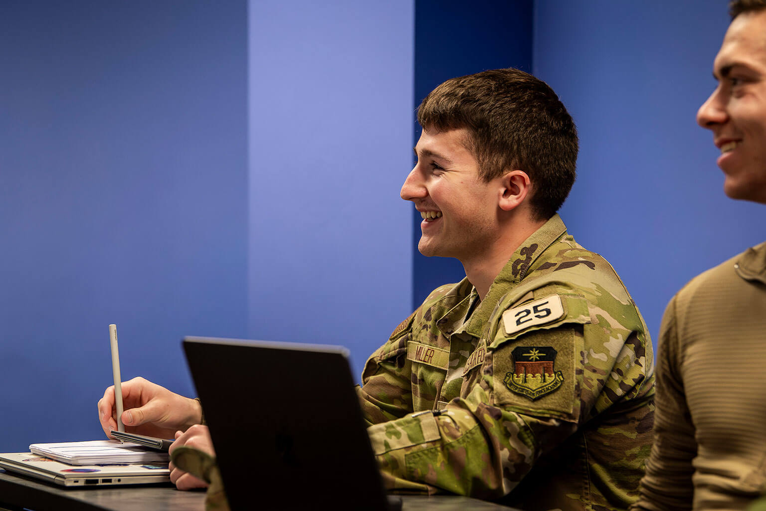 Cadet 2nd Class Brock Miller takes notes during a U.S. Air Force Academy Department of Management Leading Innovation class.