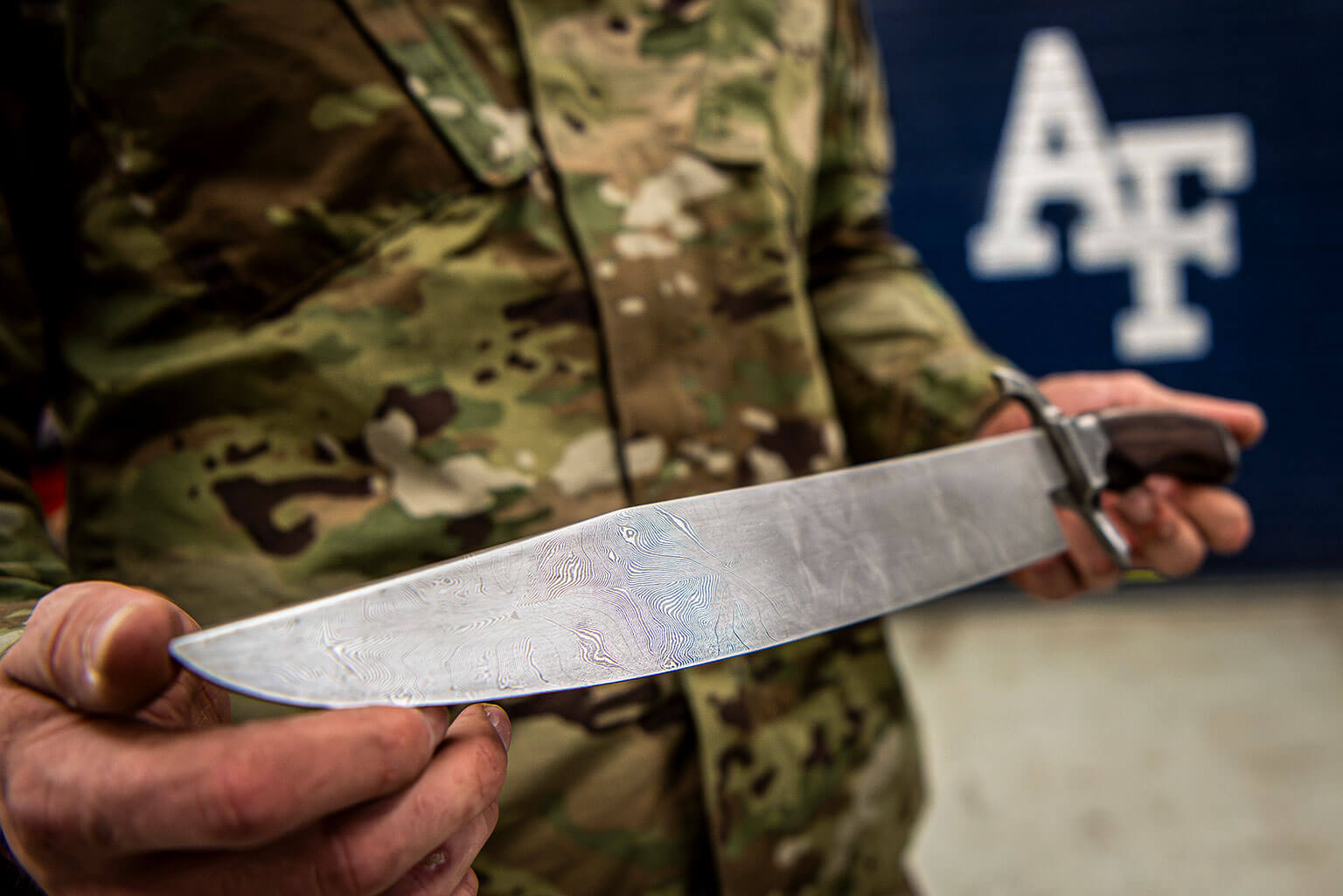 Cadet 1st Class Colton O’Dell displays the knife he made for the 2024 Minerals, Metals and Materials Society Bladesmithing Competition.