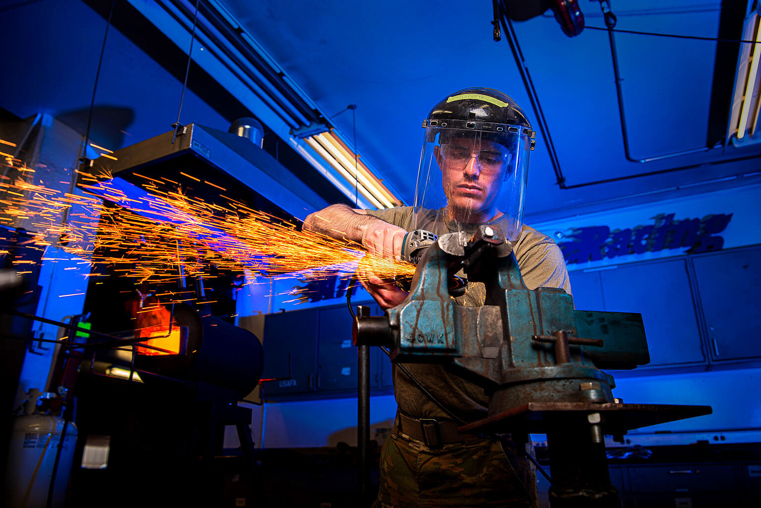 Cadet 1st Class Ryan Hebert forges a knife in the U.S. Air Force Academy Department of Mechanical Engineering.