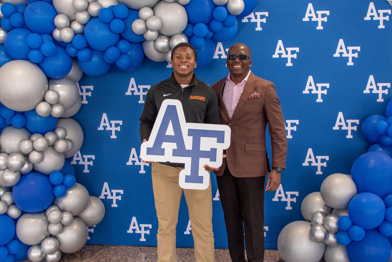 U.S. Air Force Academy appointee Elias Phiri of Hargrave Military Academy in Chatham, Va., poses with his uncle, Lweendo Chambwa.