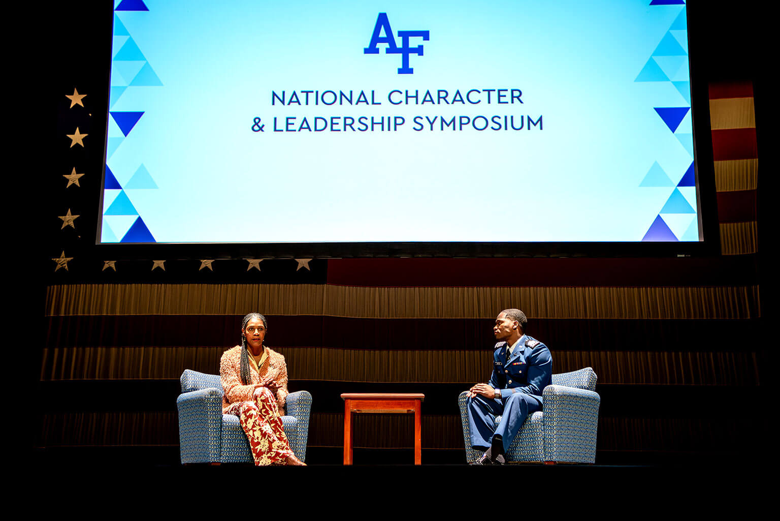 Wounded Warrior Project’s Warriors Speak spokesperson Tonya Oxendine speaks with Cadet 1st Class Nasir Rashid on stage at Arnold Hall.