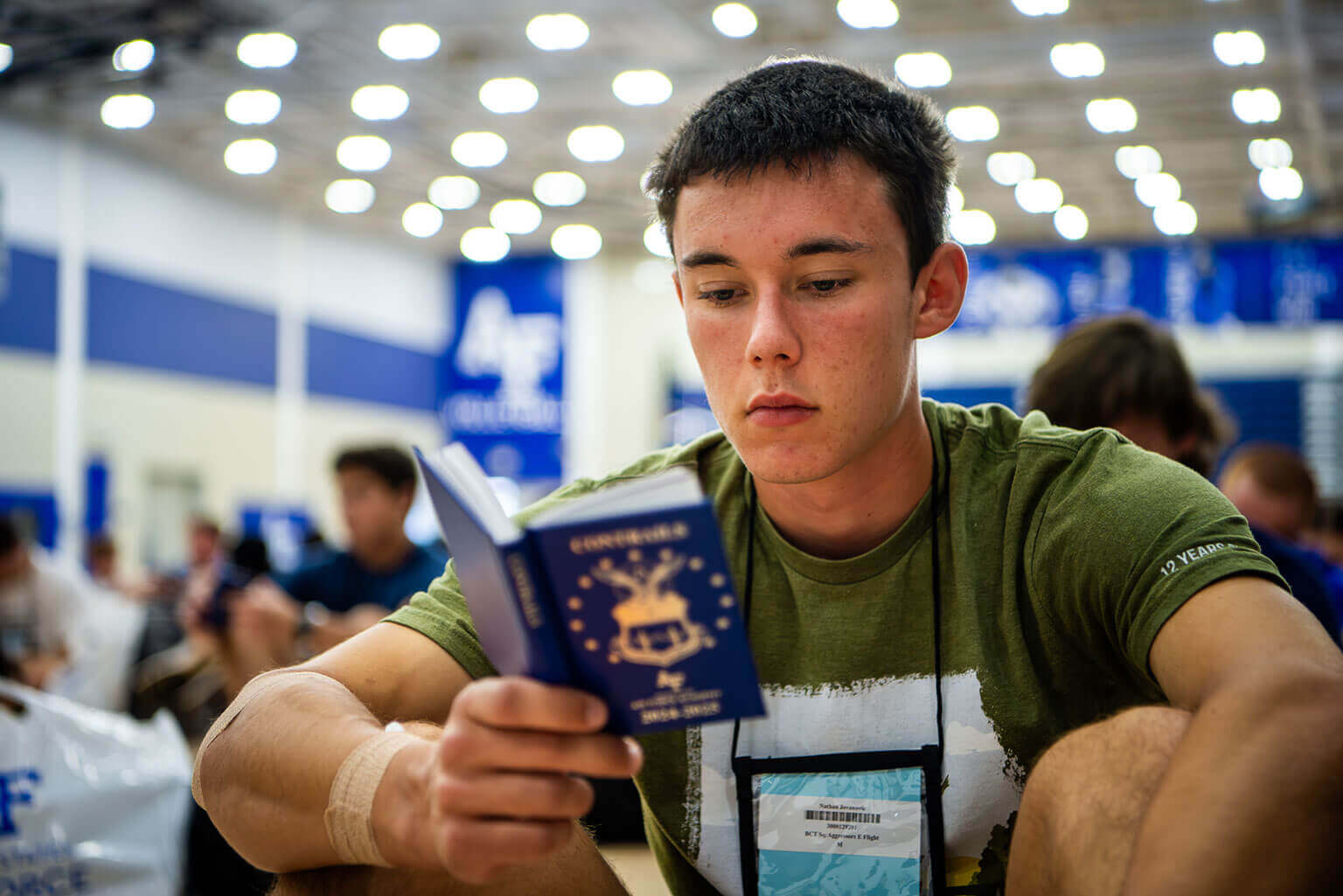 U.S. Air Force Academy appointee reading Contrails, a small book that is issued to each cadet during In-processing Day. U.S. Air Force Academy appointee reading Contrails, a small book that is issued to each cadet during In-processing Day.