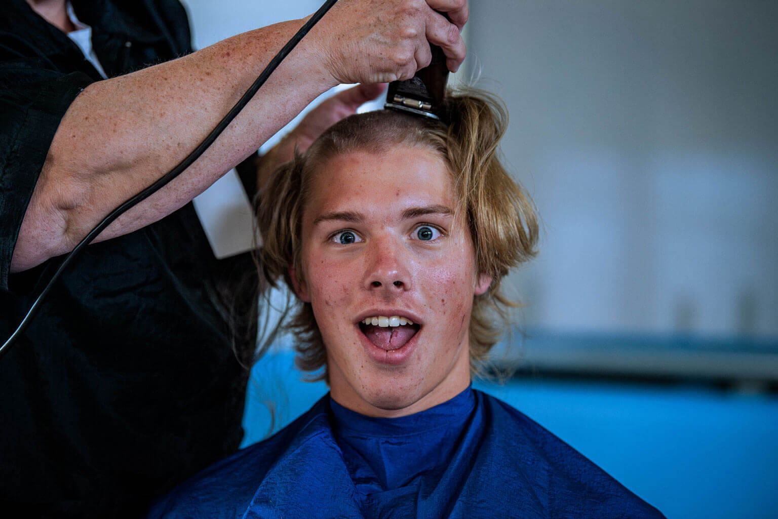 Basic Cadet receiving a traditional hair cut during In-processing Day. Basic Cadet receiving a traditional hair cut during In-processing Day.