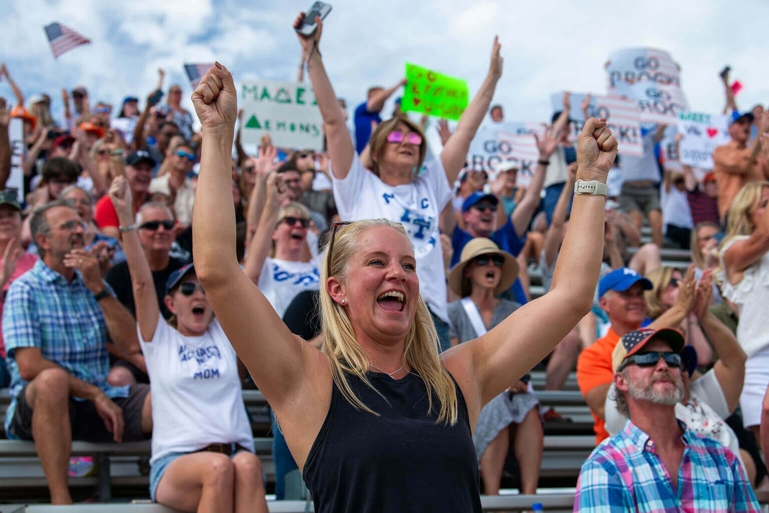 Parents raising their hands during the Swearing-In Ceremony at Stillman Field an event held the day after In-processing Day. Parents raising their hands during the Swearing-In Ceremony at Stillman Field an event held the day after In-processing Day.