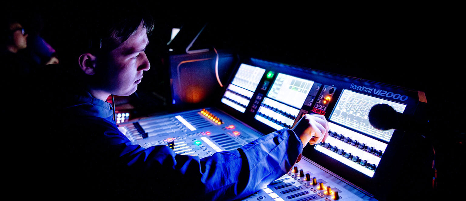 A cadet using a control board during a Bluebards production.