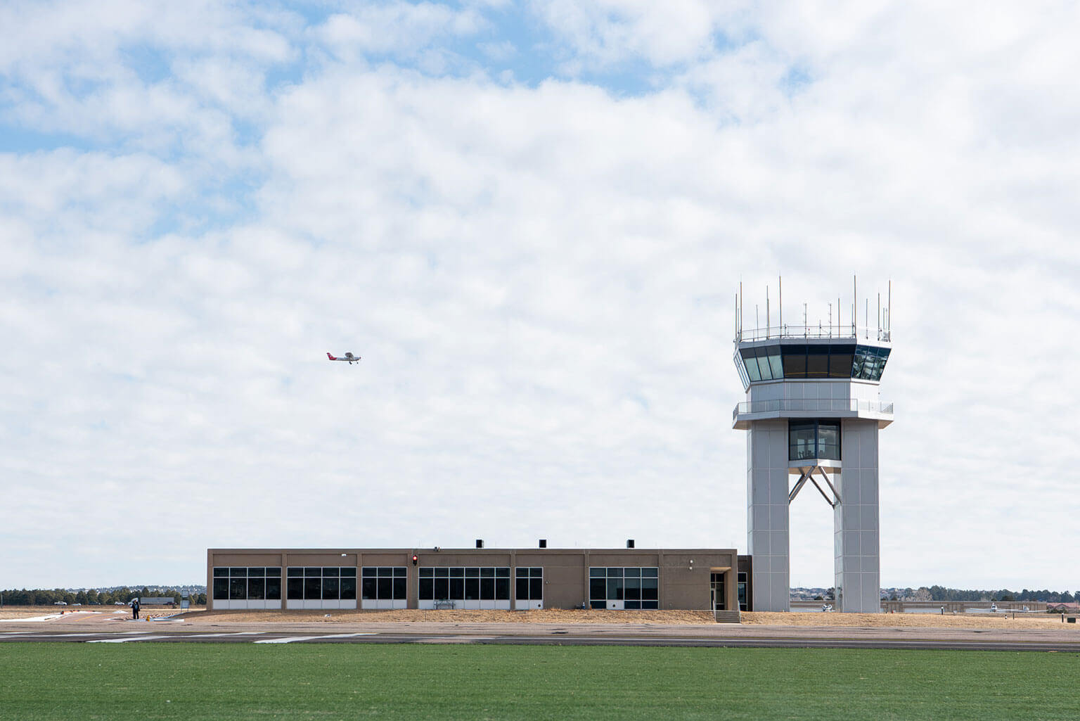 Davis Airfield control tower and a training plane in the background.