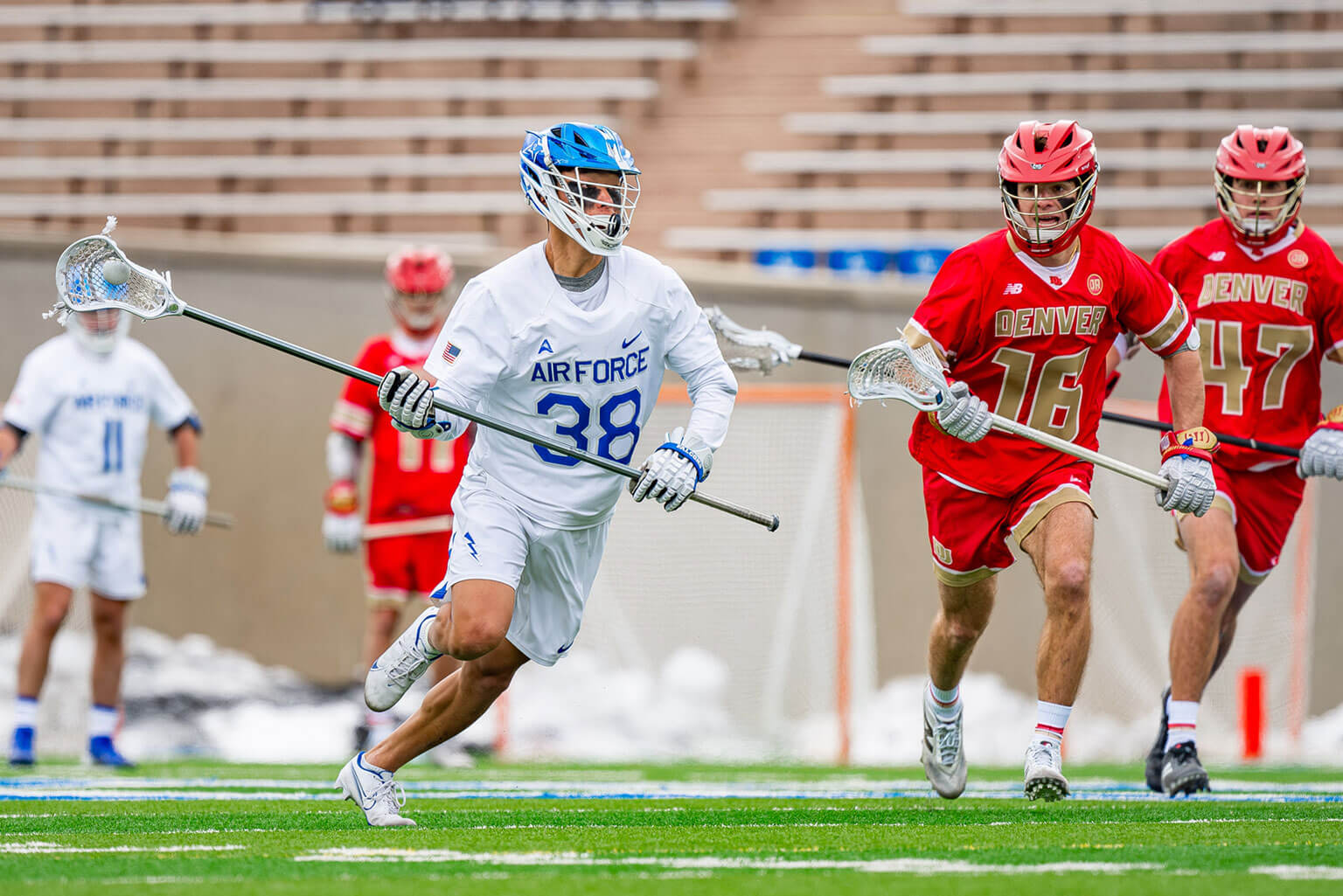 Falcon short stick defensive midfielder, Cadet 1st Class Nathan Crouse, controls the ball during the first half of a lacrosse game against Denver, Feb. 8, 2025, U.S. Air Force Academy, Colo. The Falcons, now making their fourth Division I NCAA Championship Tournament appearance, have battled to a winning record at 8-7 overall and secured the Atlantic Sun Conference lacrosse tournament championship title. (U.S. Air Force photo by Dylan Smith)