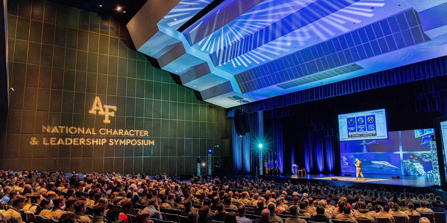 Speaker presenting at the National Character & Leadership Symposium at Arnold Hall.