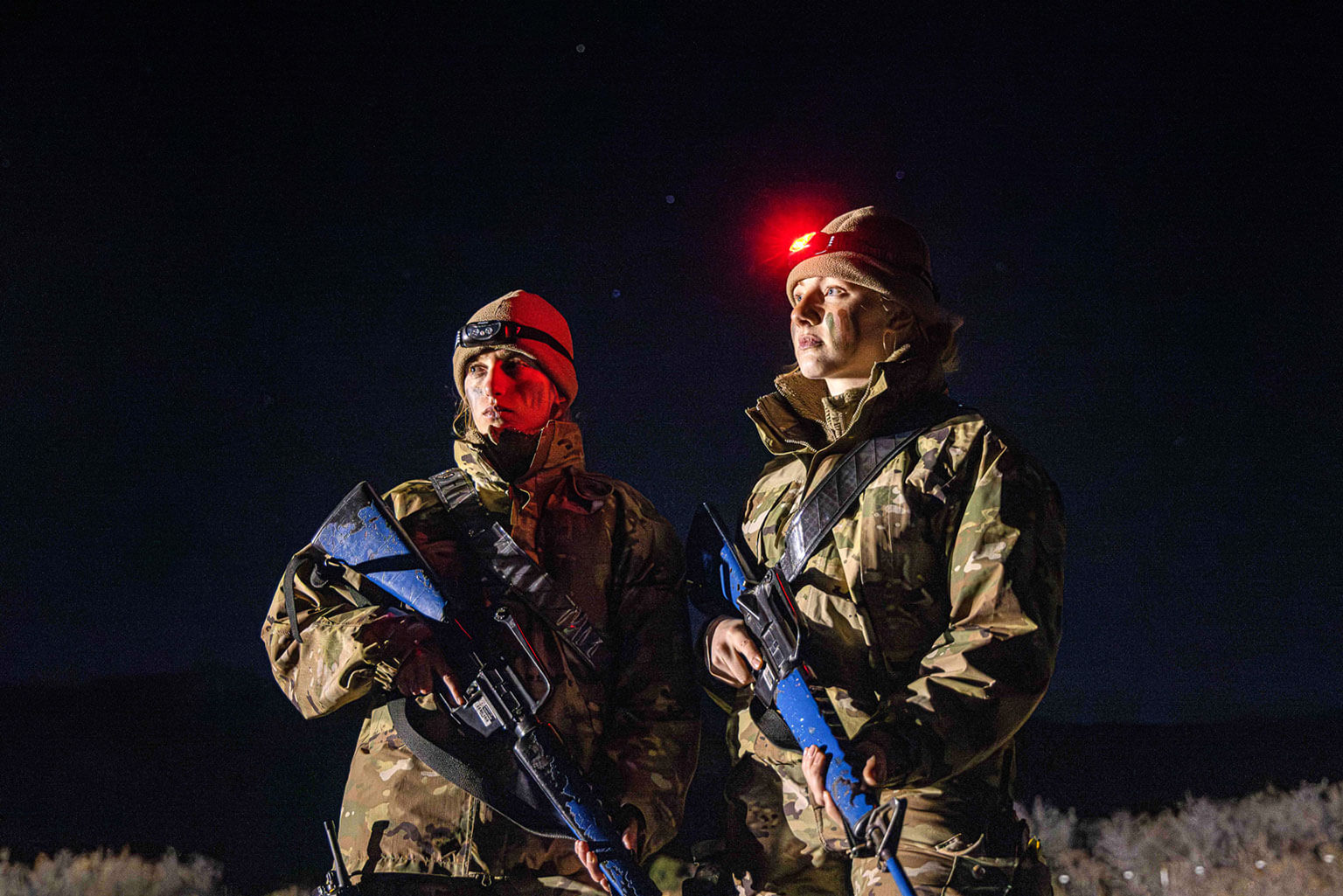 Cadets 1st Class Kathleen Horton and Paige Davis conduct nighttime operations during the 2025 Spring Culminating Exercise at the Academy, Colo., March 5, 2025. The exercise was designed to cultivate a warfighter mindset among cadets, ensuring they developed confidence in decision-making, physical and mental resilience, and realistic combat preparation. (U.S. Air Force photo by Trevor Cokley)