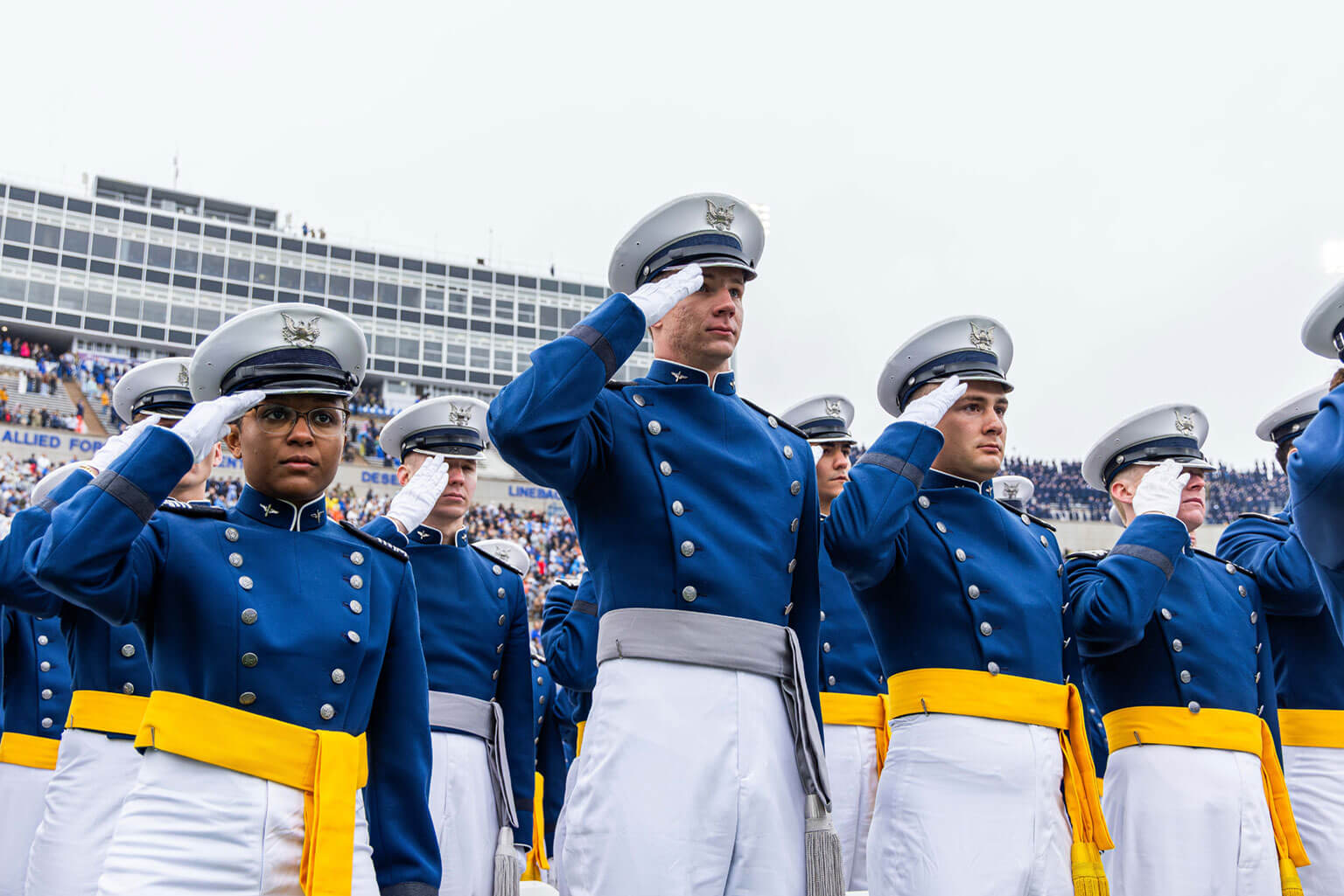 U.S. Air Force Academy cadets salute for the National Anthem during the Class of 2025 graduation ceremony in Falcon Stadium.
