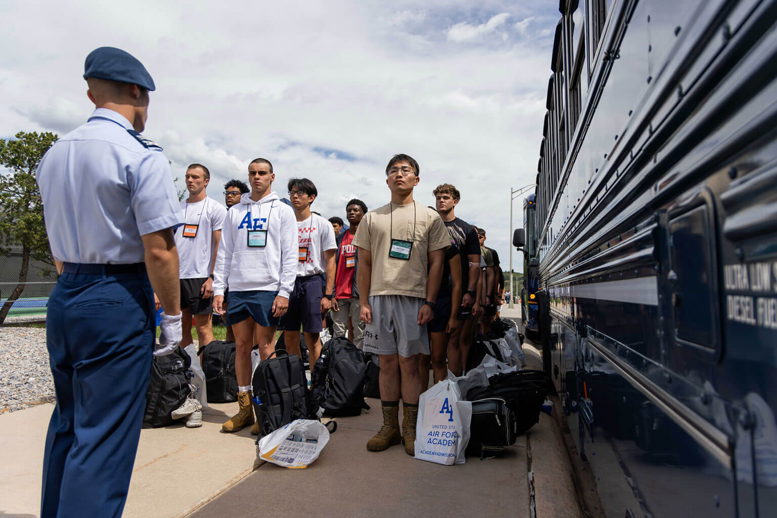 Appointees wait to board the bus that will take them to the footprints area, U.S. Air Force Academy.