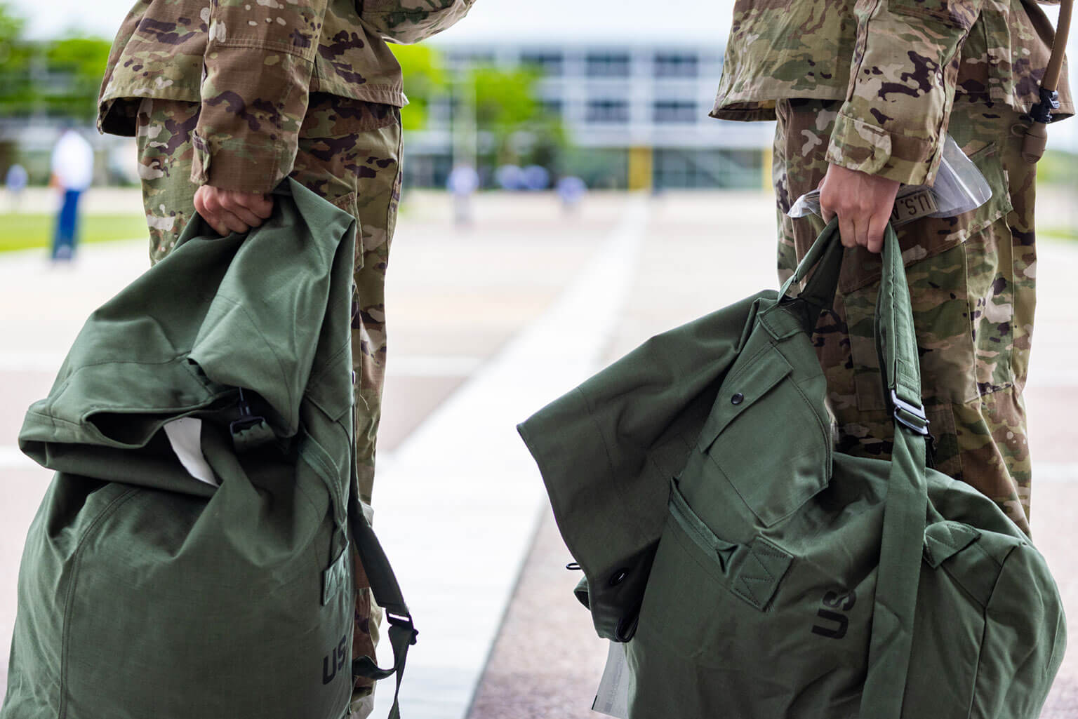 Basic cadets are issued their uniform items and bedding inside a green duffle bag. (U.S. Air Force photo by Jonathan Suni)