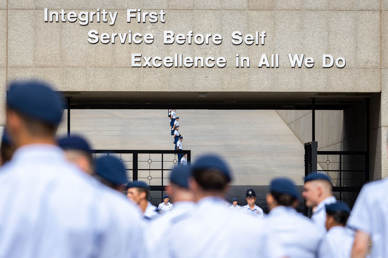 The cadet cadre waits to greet basic cadets from the Class of 2029 by the footprints at the base of the Core Values Ramp. (U.S. Air Force photo by Jonathan Suni)