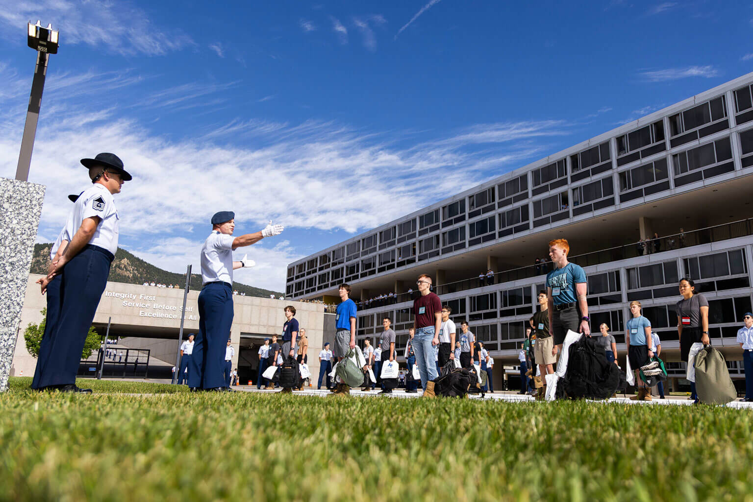 The Class of 2029 learn to stand at attention during In-processing Day. (U.S. Air Force photo by Trevor Cokley)