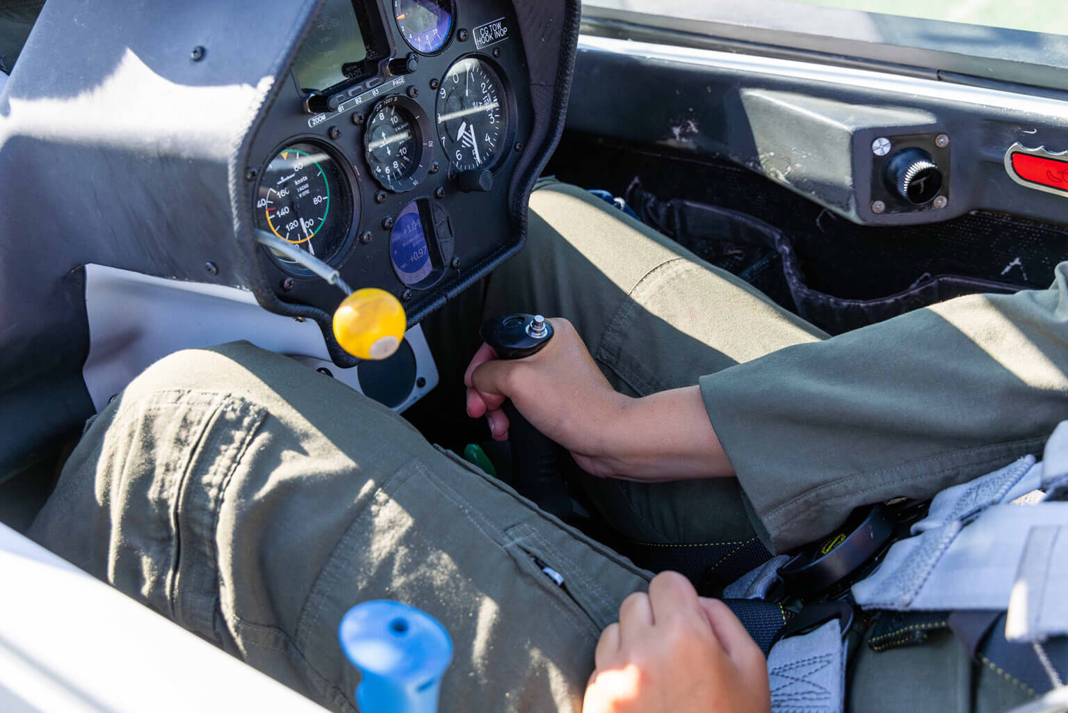 Soaring instructor Cadet 2nd Class Katherine Daley checks the glider controls before launch, Davis Airfield, U.S. Air Force Academy.