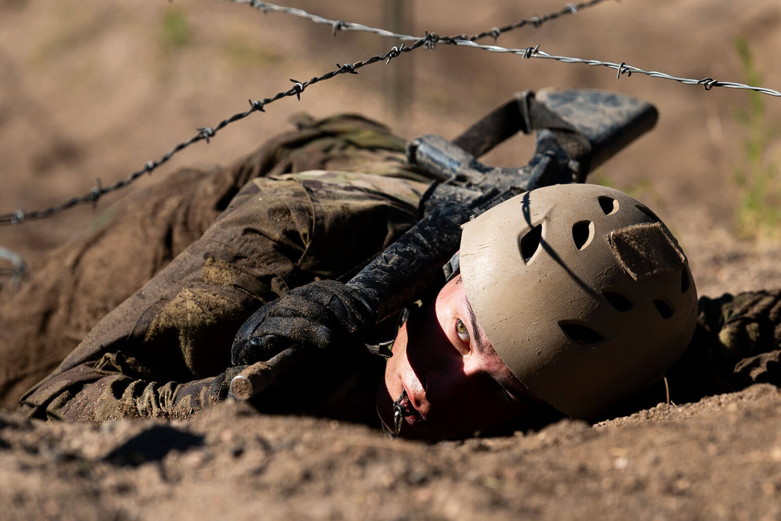 U.S. Air Force Academy basic cadet completes the Assault Course during expeditionary skills training, Jacks Valley, Colo., July 15, 2025. The objective of the Assault Course is to stimulate the warrior spirit in new Basics by familiarizing them with a rigorous and practical application of hand-to-hand combat; negotiate a time obstacle course with a fixed bayonet and compete in a judge pugil fight. (U.S. Air Force photo by Ray Bahner)