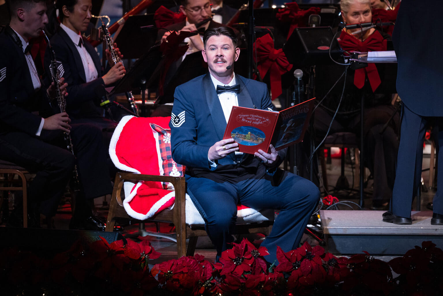 TSgt Matthew Brooker reads “The Night Before Christmas” during the annual Holly and Ivy concert series at Memorial Hall in Pueblo, CO.