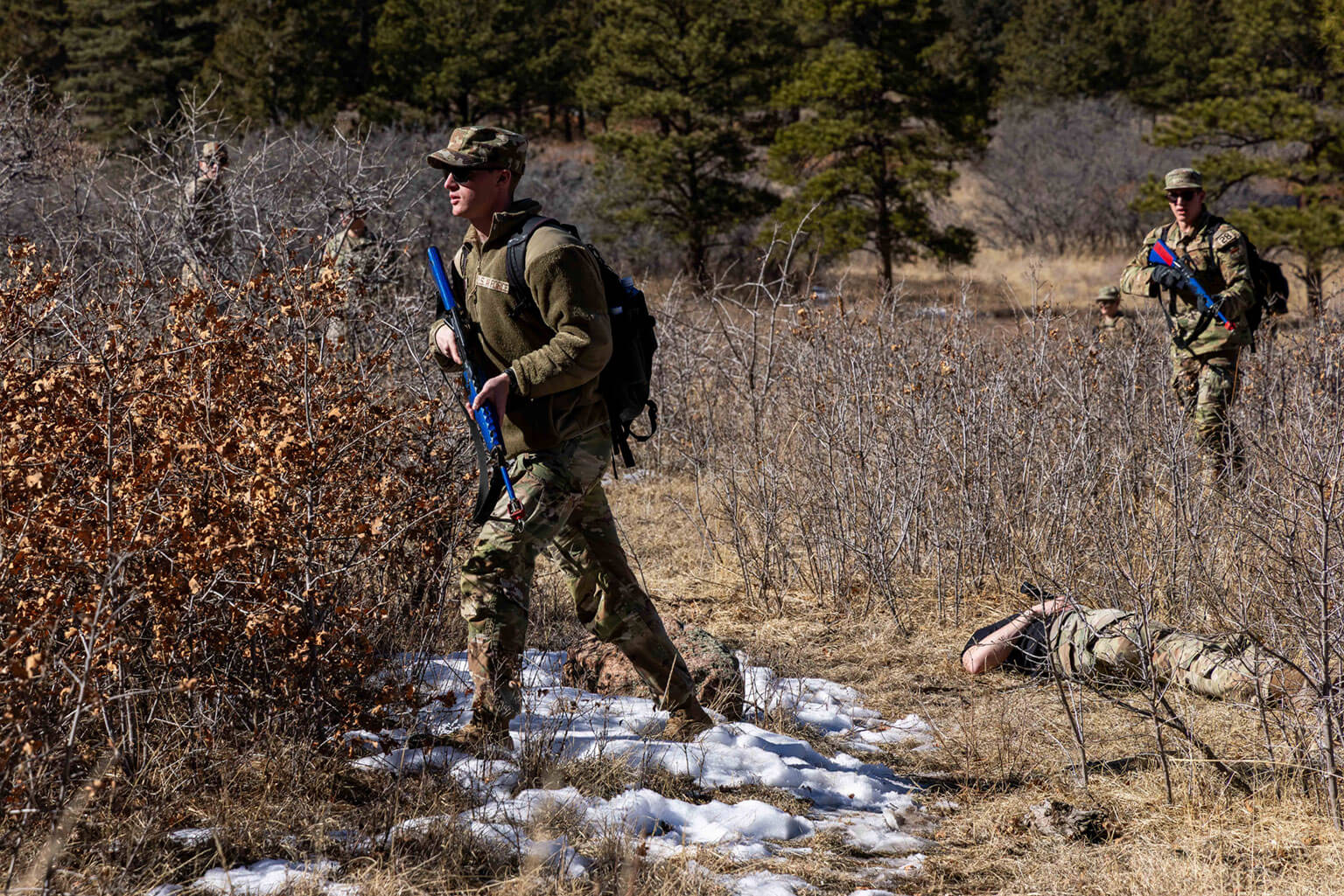 Cadets participate in small-unit tactics scenarios as the Cadet Wing conducts silver weekend training at the U.S. Air Force Academy, Colorado, Feb. 6, 2026. The training reinforced foundational military skills and cadet-led competencies, including simulated weapons handling, land navigation, Tactical Combat Casualty Care and mission planning. (U.S. Air Force photo by Trevor Cokley)