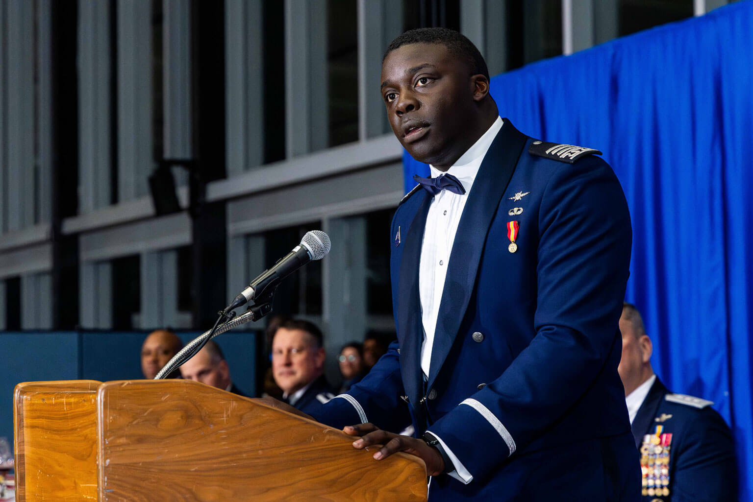 Cadet 1st Class Kobe Achu, Class of 2026 President, at the Class of 2026 100s Night dining-in ceremony at Mitchell Hall, U.S. Air Force Academy, Colorado, Feb. 12, 2026. This formal dinner marks 100 days remaining before commissioning and graduation. (U.S. Air Force Photo by Trevor Cokley)
