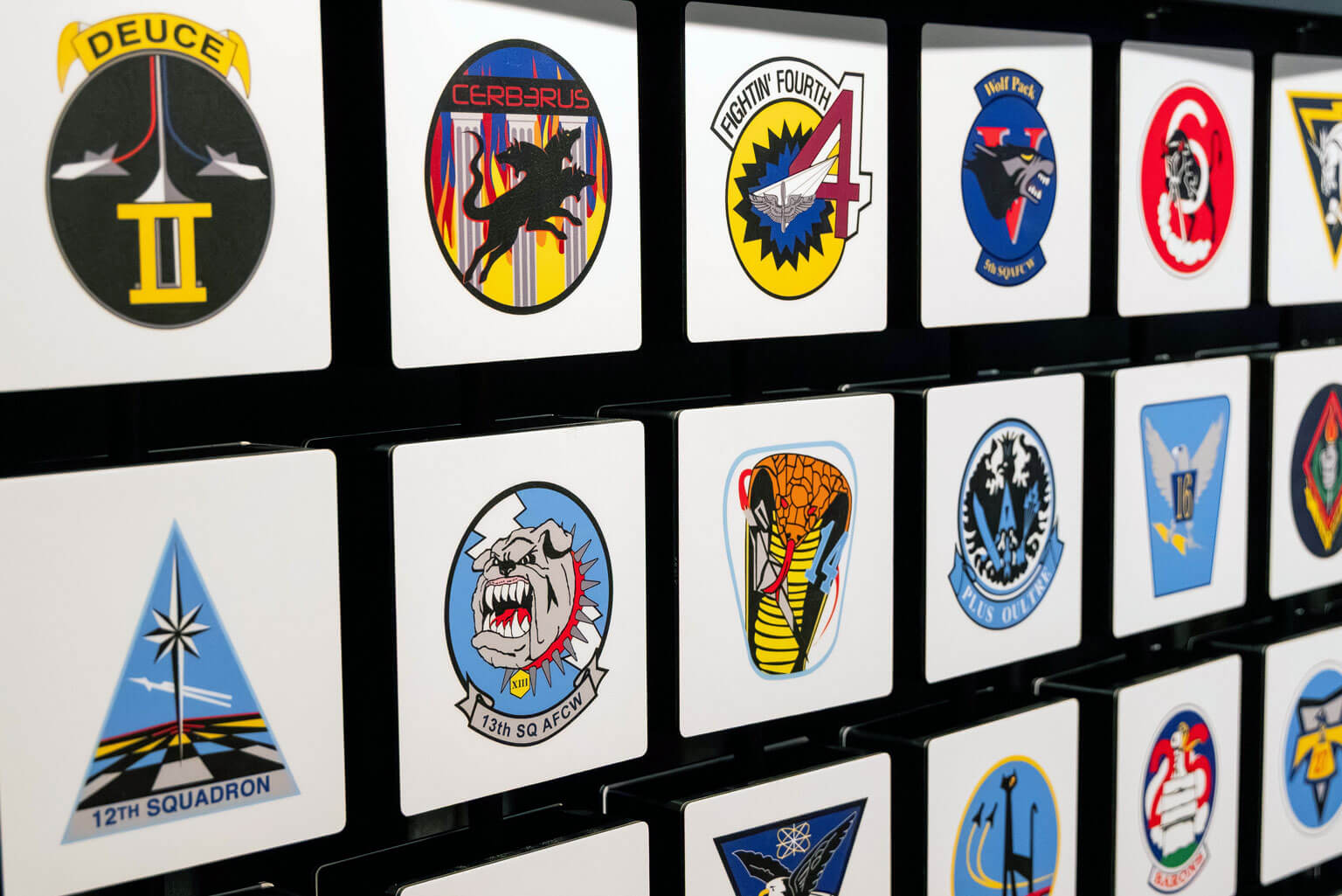 Collection of U.S. Air Force Academy emblems highlighting the rich history of 40 cadet squadrons through their distinctive patches.