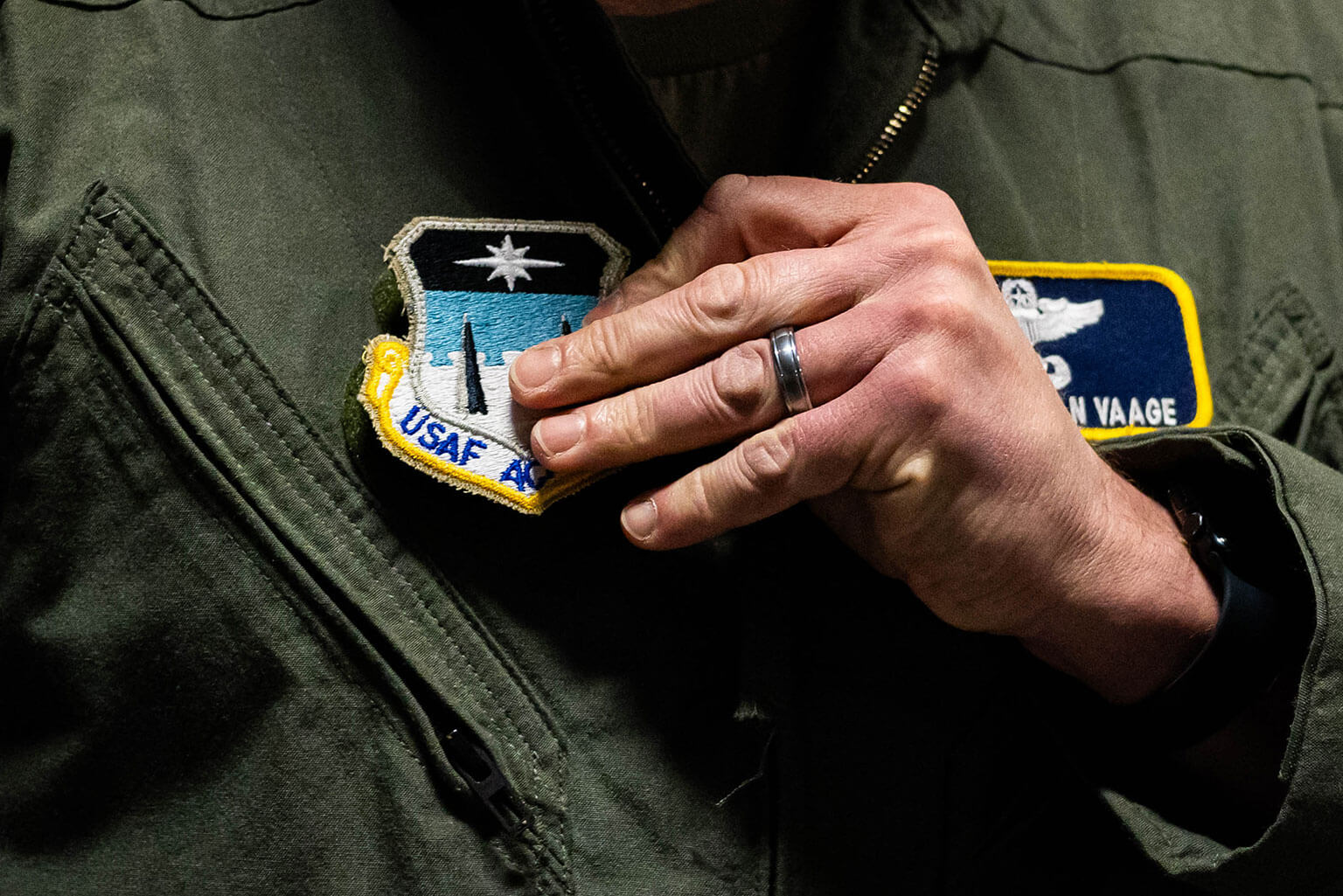 Lt. Col. Jonathan B. Vaage, 98th Flying Training Squadron commander, swaps an Air Education and Training Command patch for a U.S. Air Force Academy one during a ceremony on Davis Airfield here April 1, 2026. The patching ceremony marked the historic realignment of the 306th Flying Training Squadron, of which the 98th FTS is a part, from AETC to the Academy headquarters. (U.S. Air Force photo by Jonathan Suni)