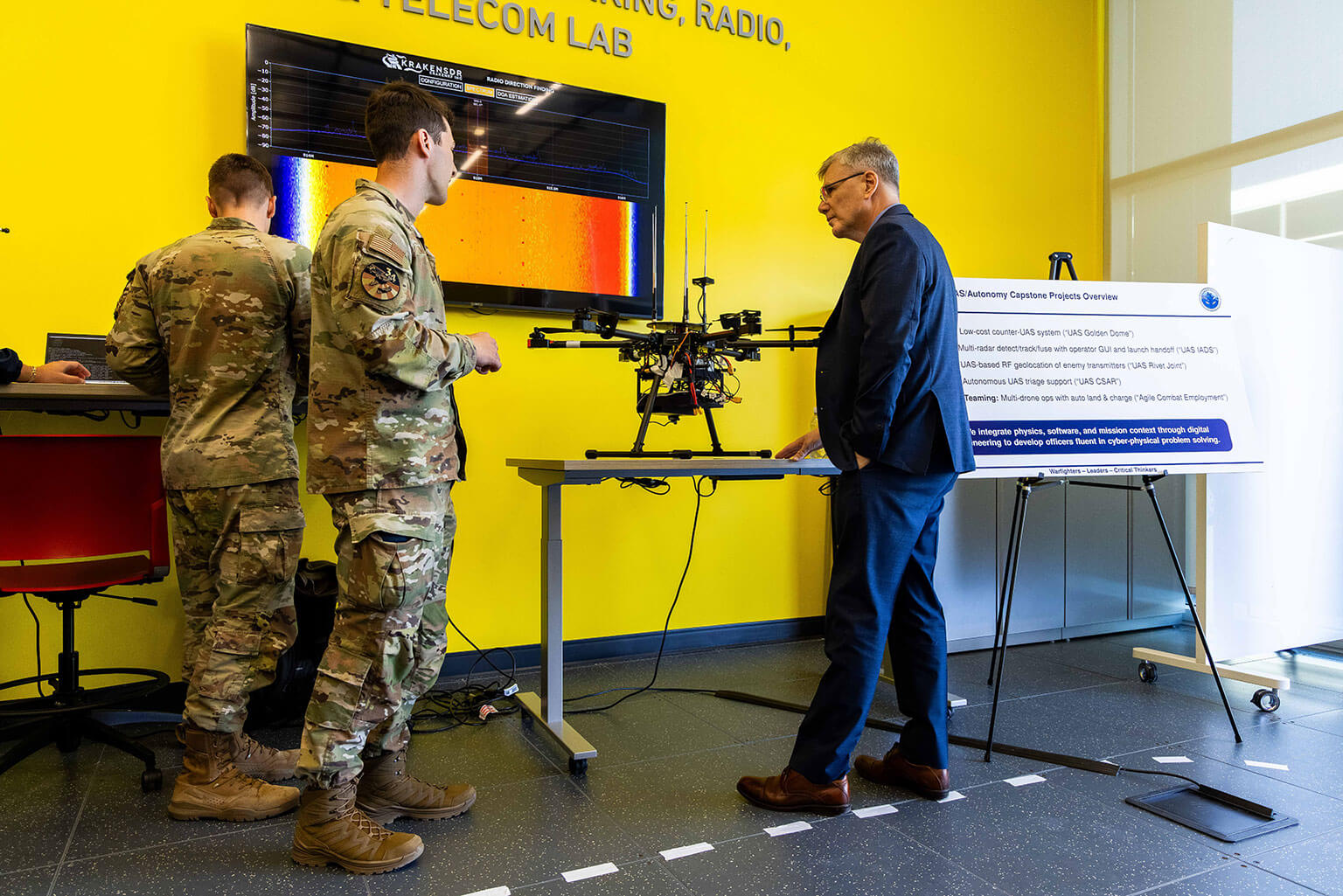 Secretary of the Air Force Troy Meink observes a demonstration inside the Madera Cyber Innovation Center at the U.S. Air Force Academy, Colo., April 13, 2026. The visit showcased the Academy’s growing emphasis on cyber and technology education, which is critical to developing leaders prepared for future warfare. (U.S. Air Force photo by Trevor Cokley)