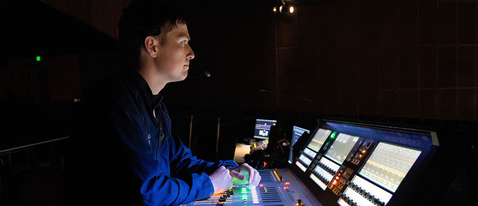 A U.S. Air Force Academy cadet using a control board at Arnold Hall.
