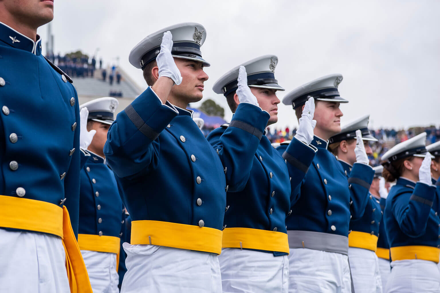 U.S. Air Force Academy cadets raise their right hands while taking the oath of office at the Class of 2026 graduation ceremony at Falcon Stadium May 28, 2026. Class of 2026 stats show the graduates joined a legacy of more than 57,000 officers commissioned by the Academy since 1959. (U.S. Air Force photo by Trevor Cokley)
