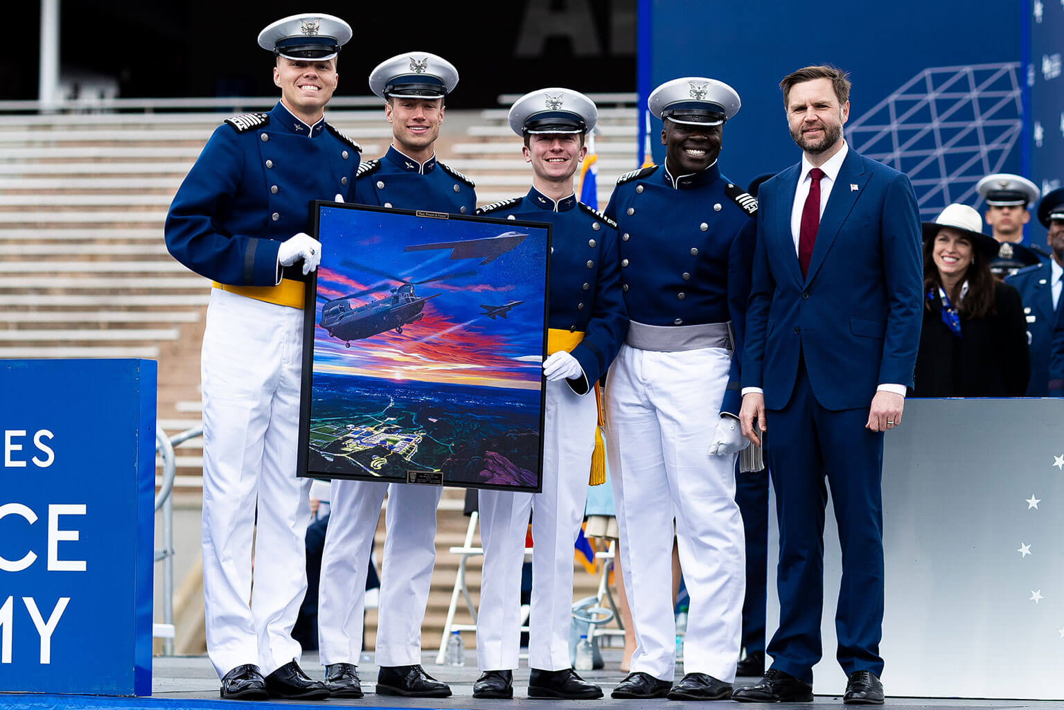 Cadets present the class gift to Vice President of the United States JD Vance during the U.S. Air Force Academy’s Class of 2026 graduation ceremony held at Falcon Stadium on the Academy, Colo., May 28, 2026. The Class of 2026 continued the tradition of presenting a ceremonial class gift to their commencement speaker, symbolizing the shared commitment to national defense between the nation's leadership and its newest warfighters. (U.S. Air Force photo by Ray Bahner)