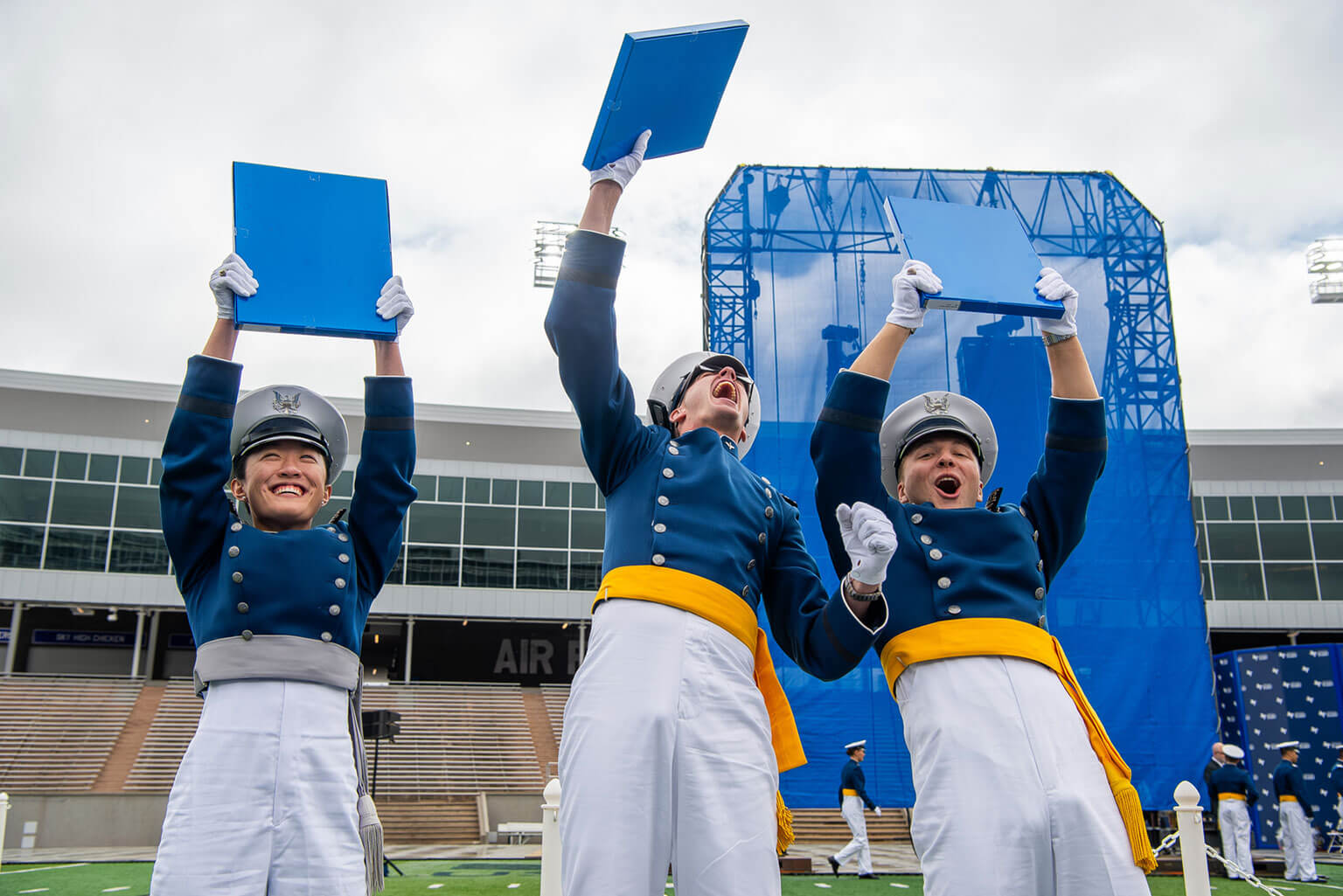 Cadets hold up their diplomas after the U.S. Air Force Academy Class of 2026 graduation ceremony at Falcon Stadium May 28, 2026. Class of 2026 stats show that 49% of graduates will attend pilot training. (U.S. Air Force photo by Trevor Cokley) 