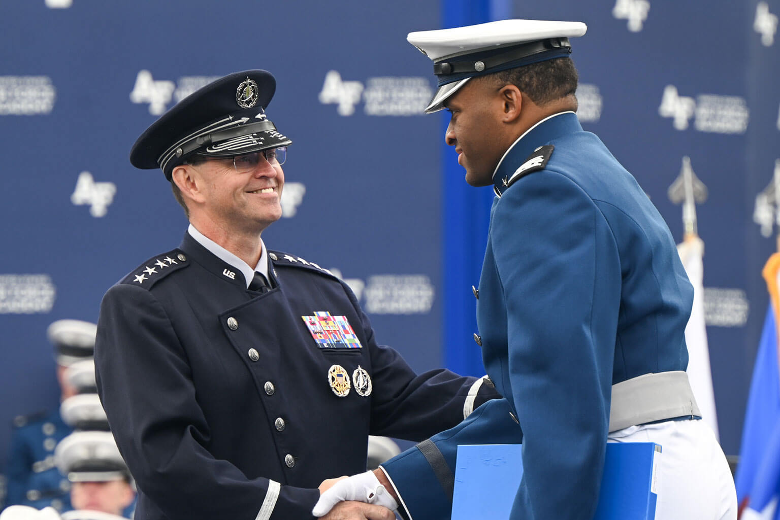 Chief of Space Operations Gen. Chance Saltzman shakes hands with a cadet during the U.S. Air Force Academy’s 2026 graduation ceremony held at Falcon Stadium on the Academy, Colo., May 28, 2026. Saltzman welcomed the Academy's newest Space Force Guardians, critical thinkers trained to adapt and secure the nation's interests in an increasingly complex and contested space domain. (U.S. Air Force photo by TSgt. Stuart Bright)